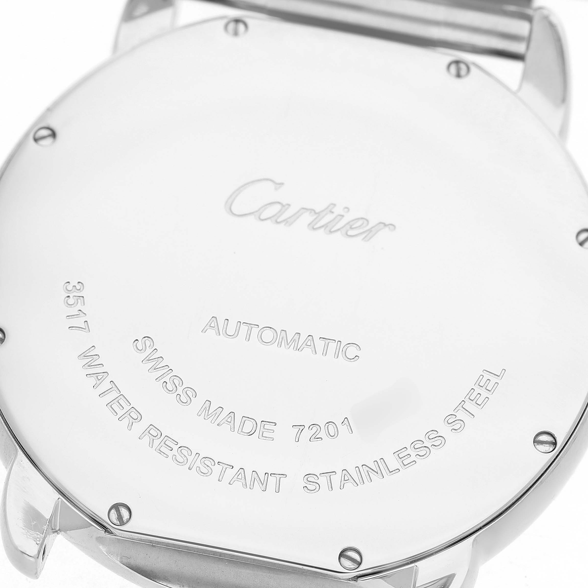 The image shows the back case of a Cartier Ronde W6701011 Men's Stainless Steel Silver Dial model, featuring engraved details and screws.