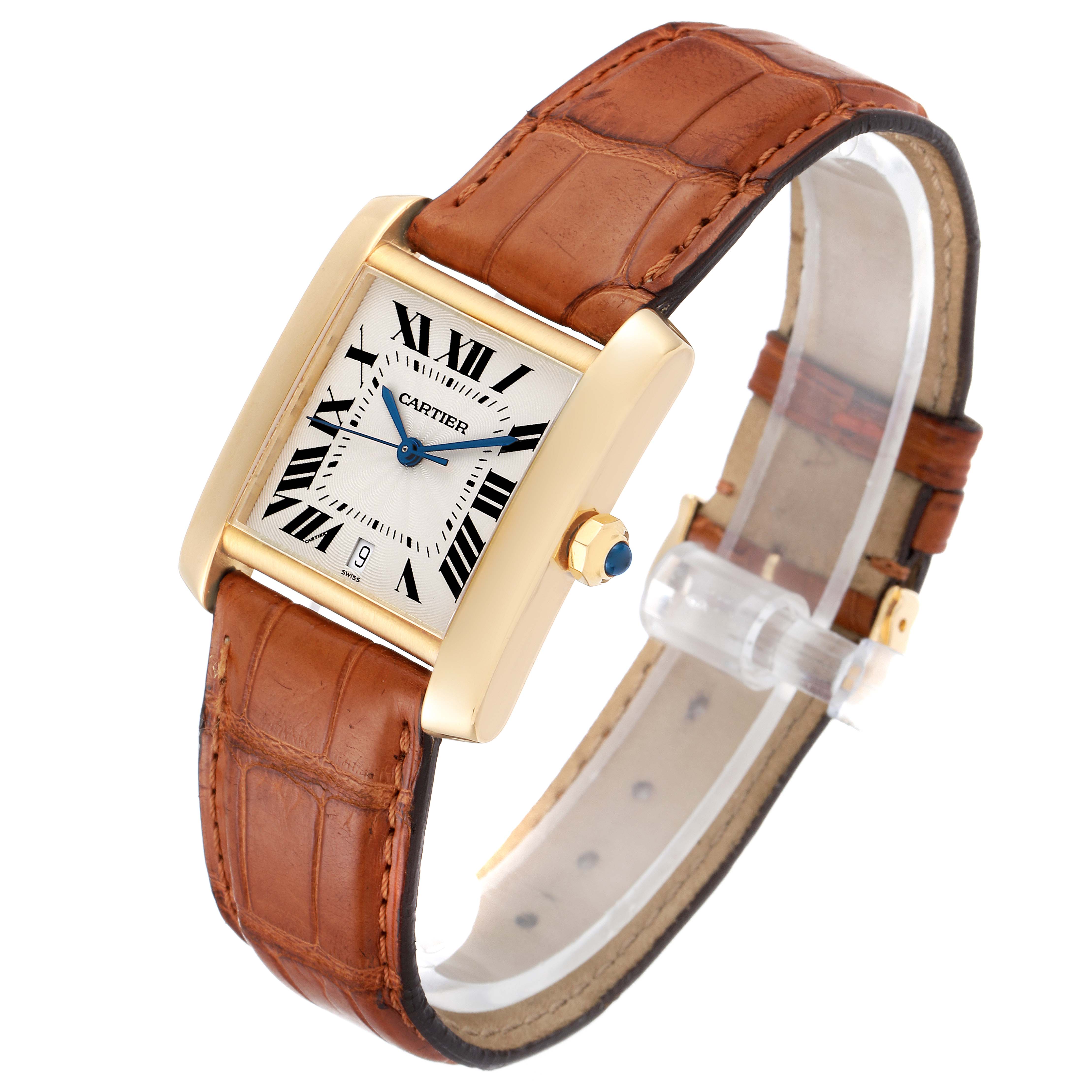 This image shows a Cartier Tank Francaise W5000156 Men's Yellow Gold Silver Dial W5000156 Men's Yellow Gold Silver Dial watch at an oblique angle, highlighting the face, crown, and leather strap.