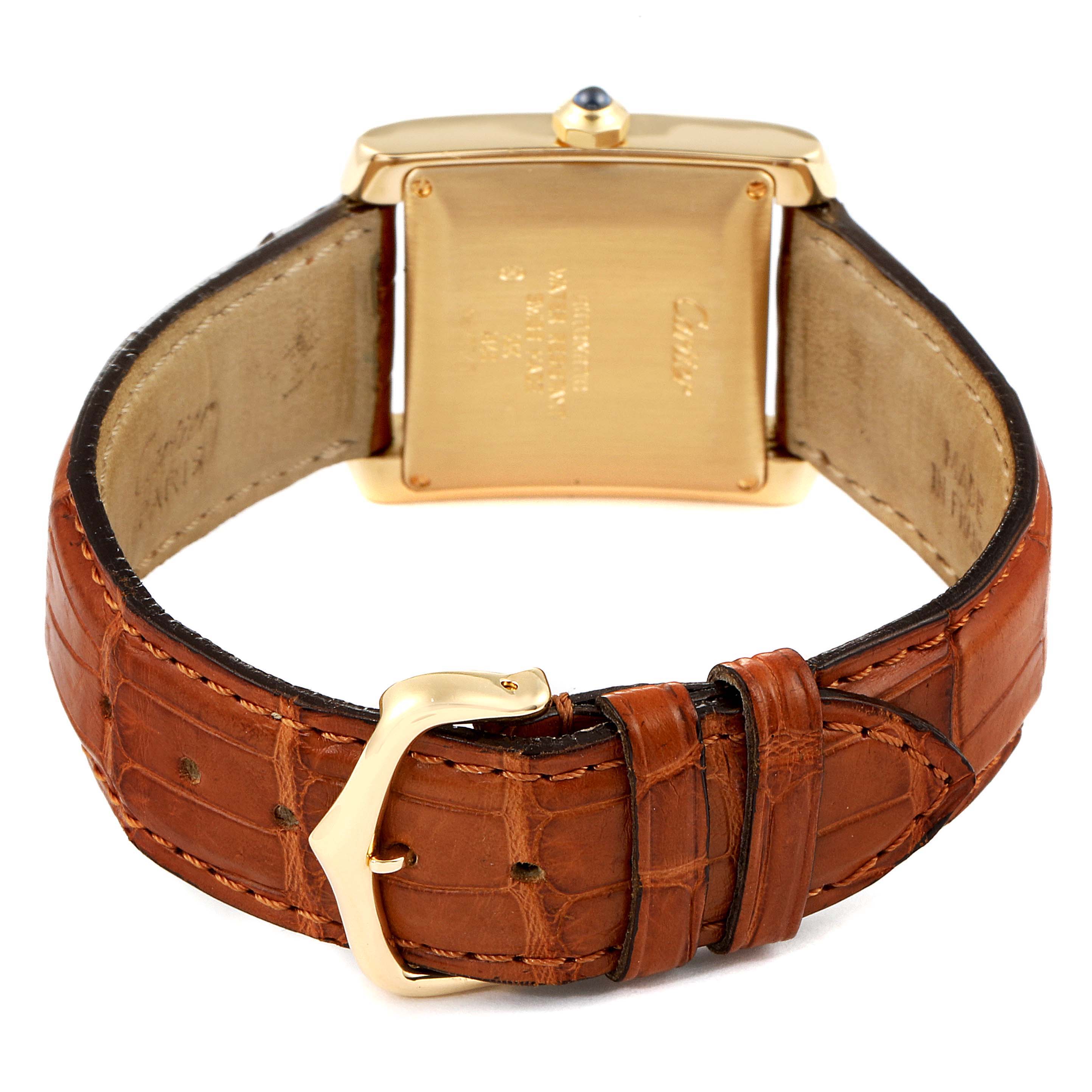 This image shows the back and clasp of a Cartier Tank Francaise W5000156 Men's Yellow Gold Silver Dial W5000156 Men's Yellow Gold Silver Dial watch with a brown leather strap.