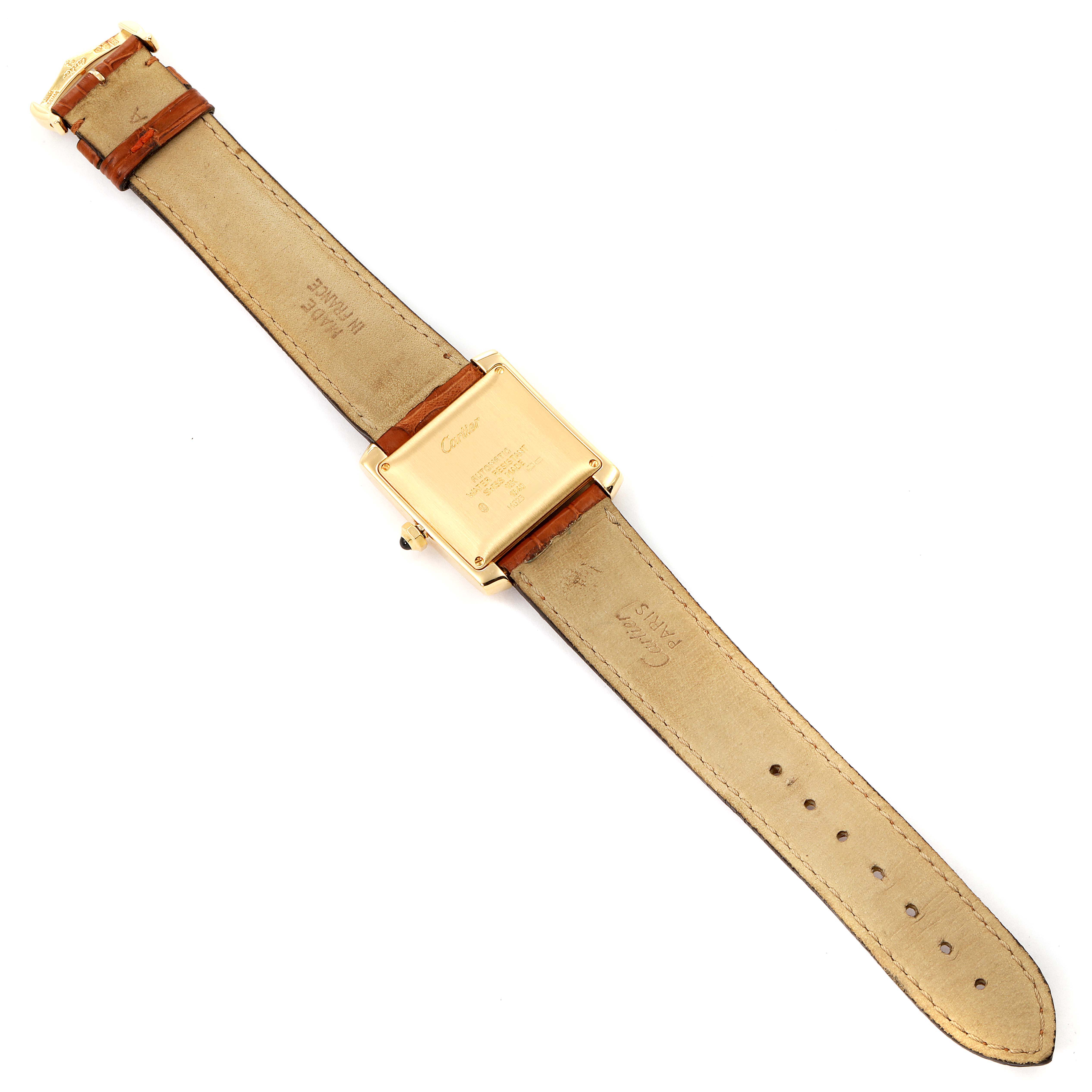 The image shows the back view of a Cartier Tank Francaise W5000156 Men's Yellow Gold Silver Dial W5000156 Men's Yellow Gold Silver Dial watch, including its leather strap and the case back details.