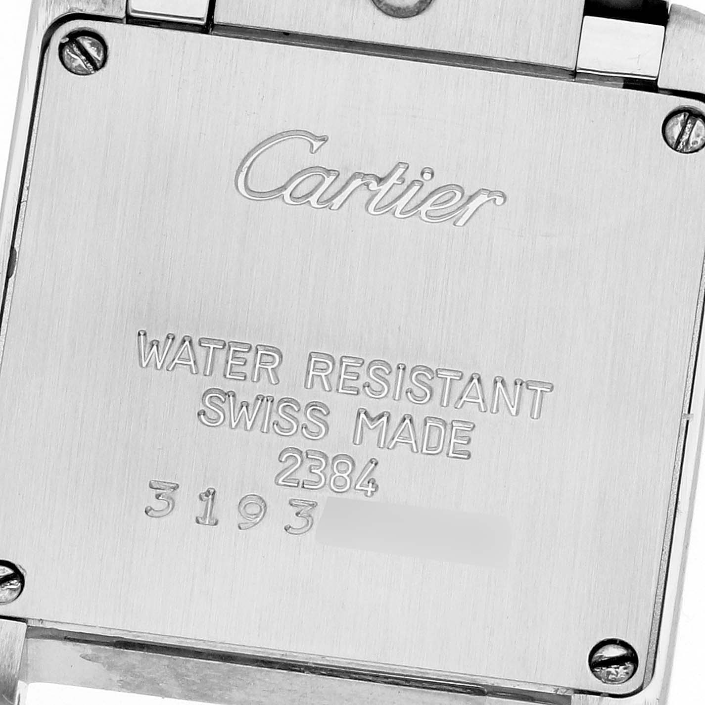 The image shows the back case of a Cartier Tank Francaise W51007Q4 Women
s Steel and Gold (two tone) Silver Dial W51007Q4 Women
s Steel and Gold (two tone) Silver Dial watch, highlighting its engravings including water resistance, Swiss-made, and serial numbers.