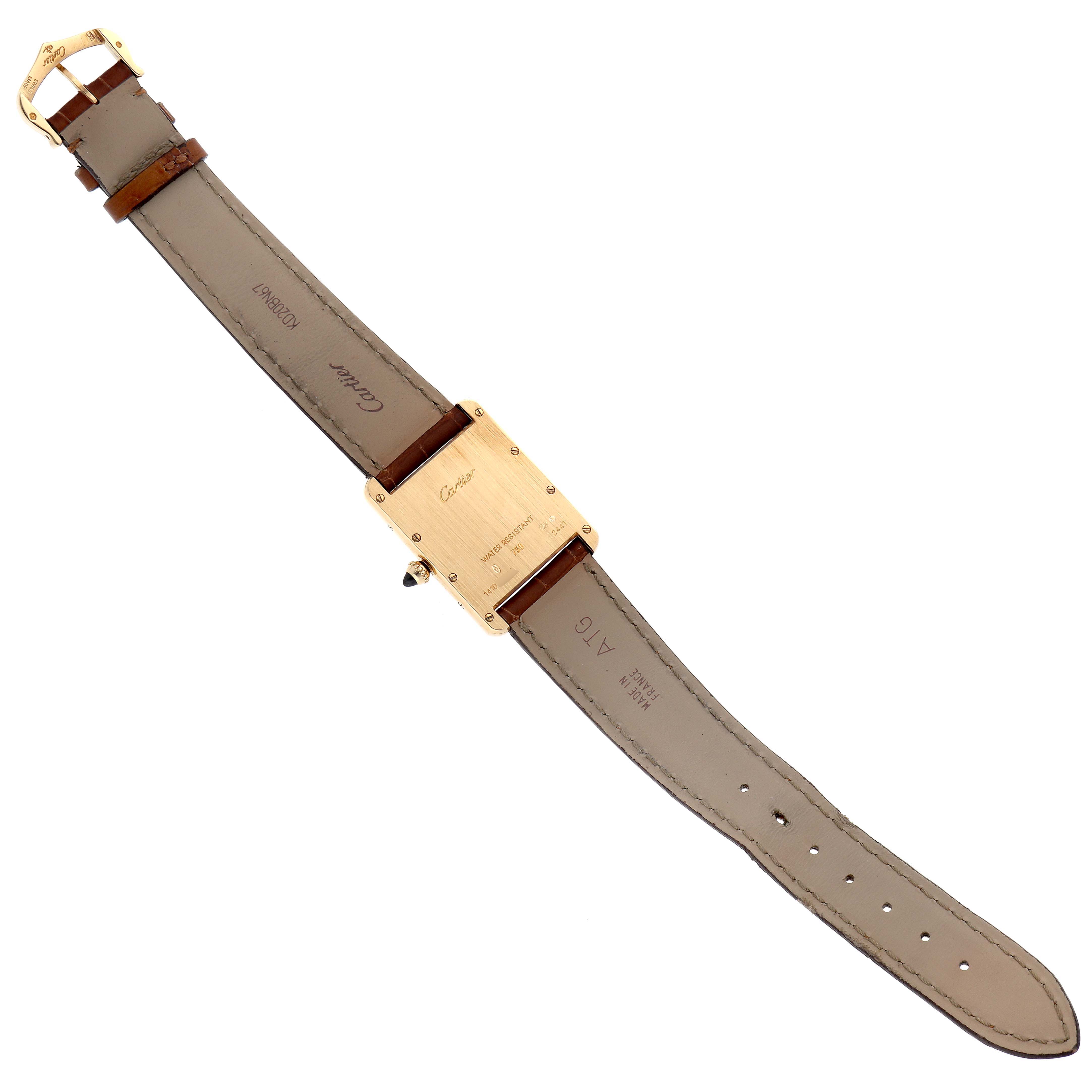 The image shows the back view of a Cartier Tank Louis W1529756 Men
s Yellow Gold Silver Dial W1529756 Men
s Yellow Gold Silver Dial watch, displaying the leather strap and the case back.