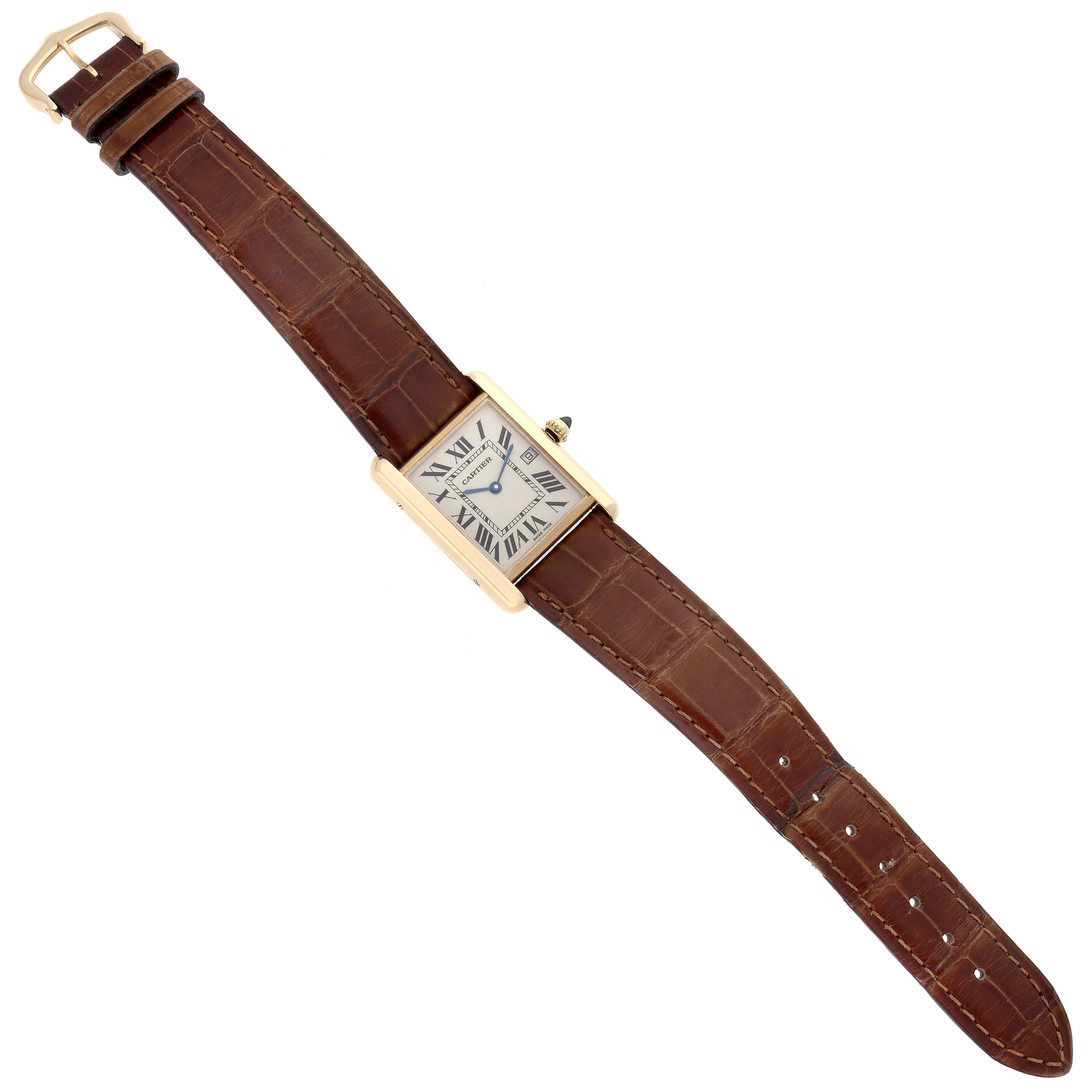 The image shows a top-down view of a Cartier Tank Louis W1529756 Men
s Yellow Gold Silver Dial W1529756 Men
s Yellow Gold Silver Dial watch with its brown leather strap fully extended.