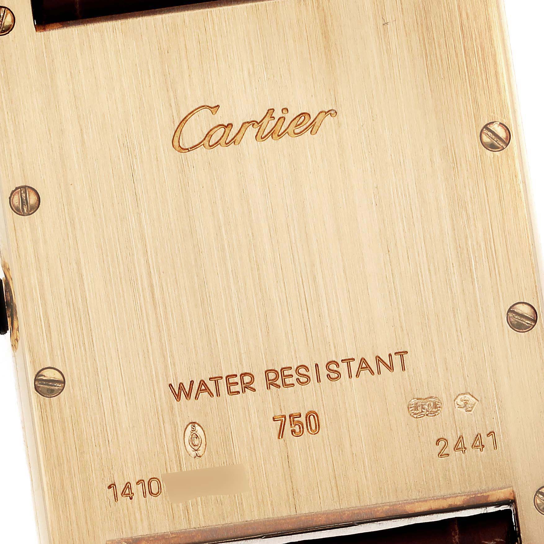 This image shows the back case of the Cartier Tank Louis W1529756 Men
s Yellow Gold Silver Dial W1529756 Men
s Yellow Gold Silver Dial watch, featuring brand engravings and specifications.