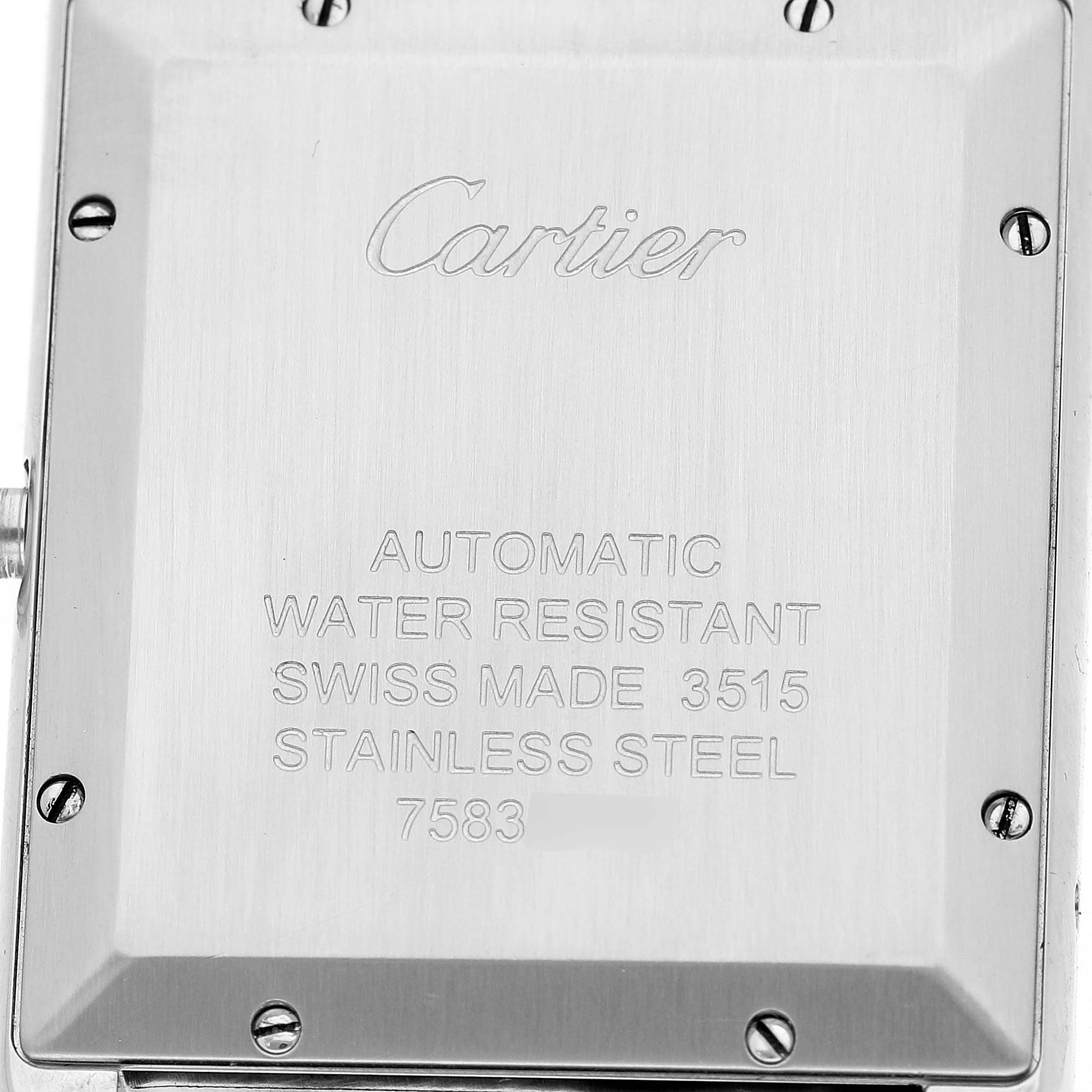 The image shows the back case of a Cartier Tank Solo W5200027 Men's Stainless Steel Silver Dial watch featuring engraved specifications in a close-up view.