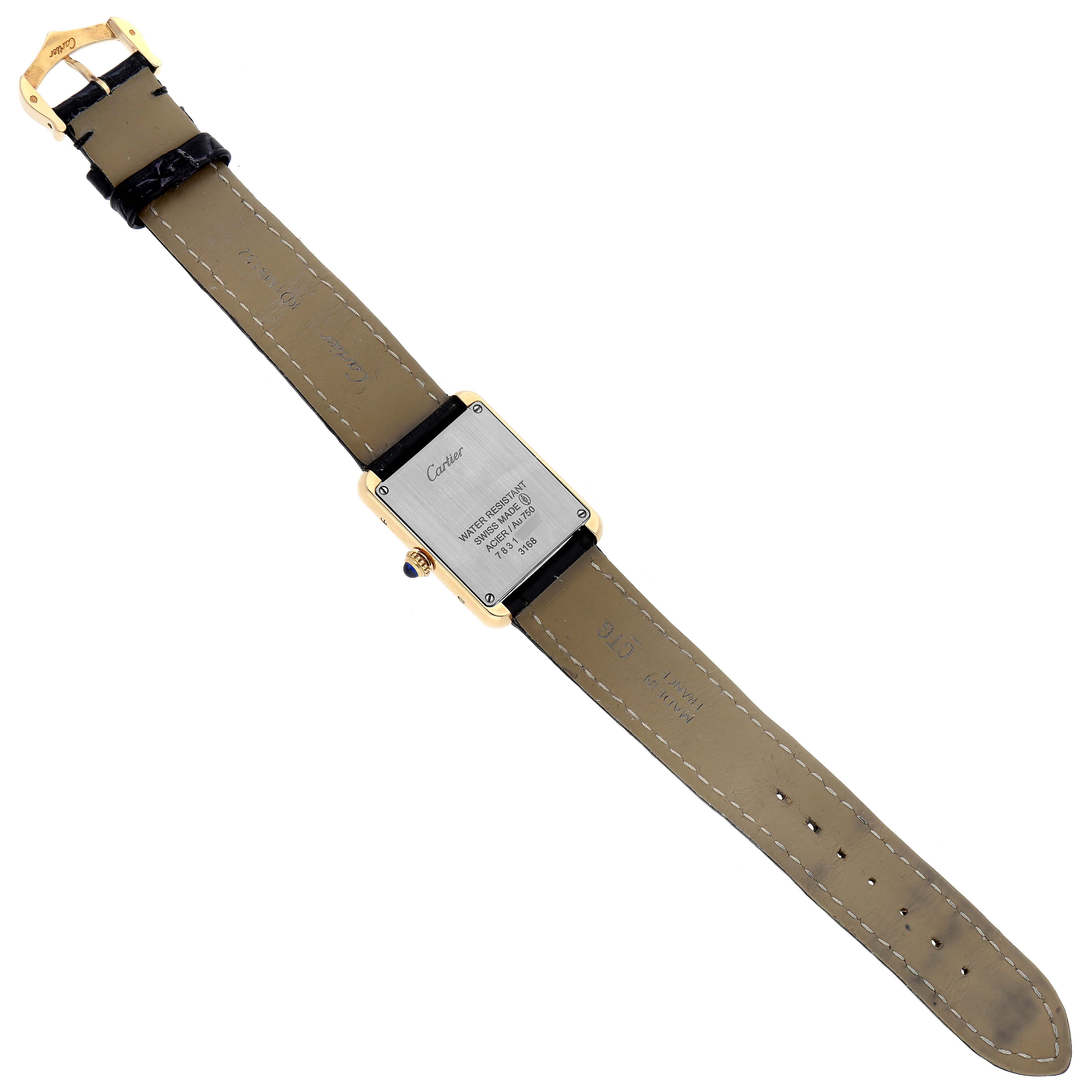 This image shows the back view of a Cartier Tank Solo W5200002 Women's Steel and Gold (two tone) Silver Dial W5200002 Women's Steel and Gold (two tone) Silver Dial watch, highlighting the case back, leather strap, and buckle.