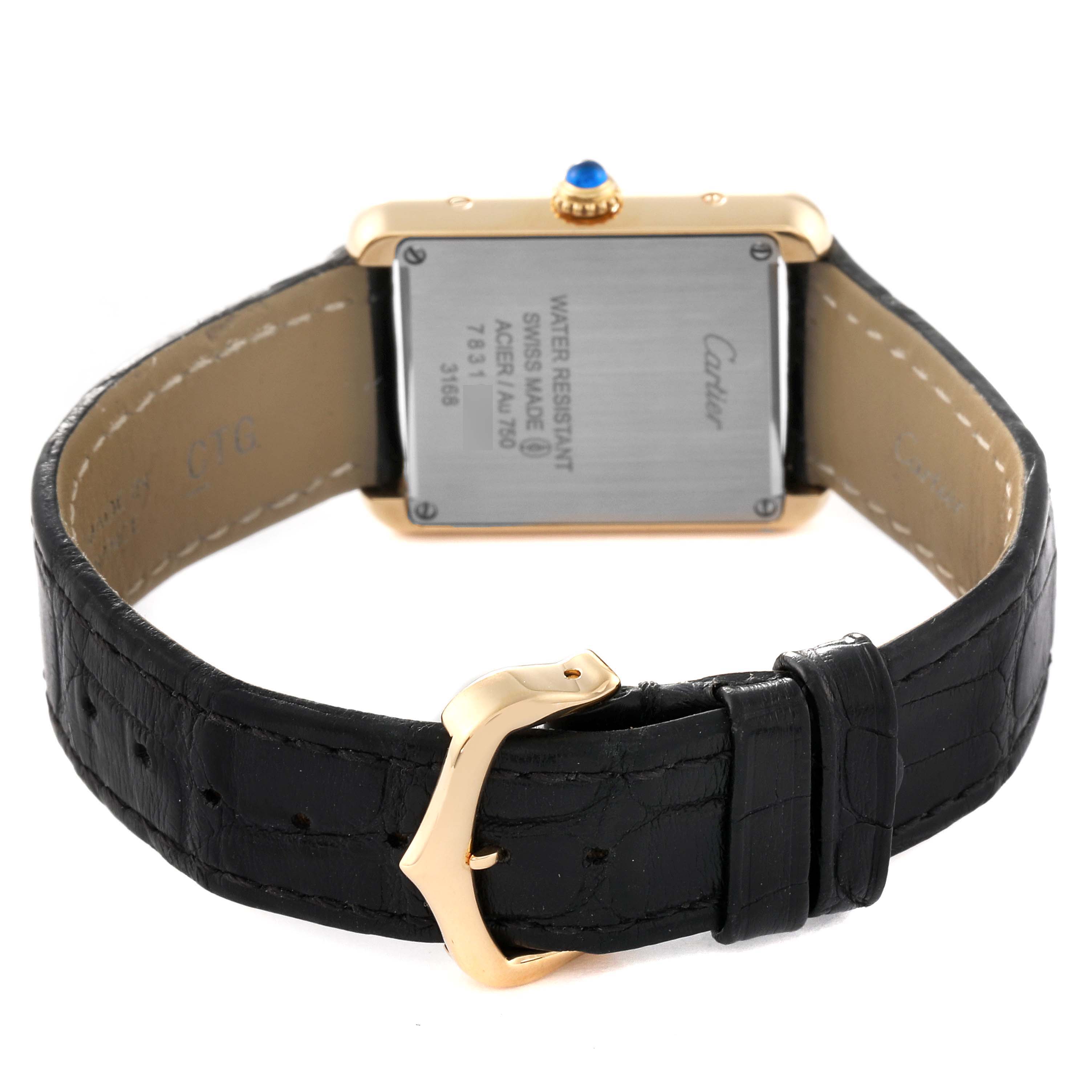 The image shows the rear view of a Cartier Tank Solo W5200002 Women's Steel and Gold (two tone) Silver Dial W5200002 Women's Steel and Gold (two tone) Silver Dial watch, showcasing its case back, strap, and clasp.