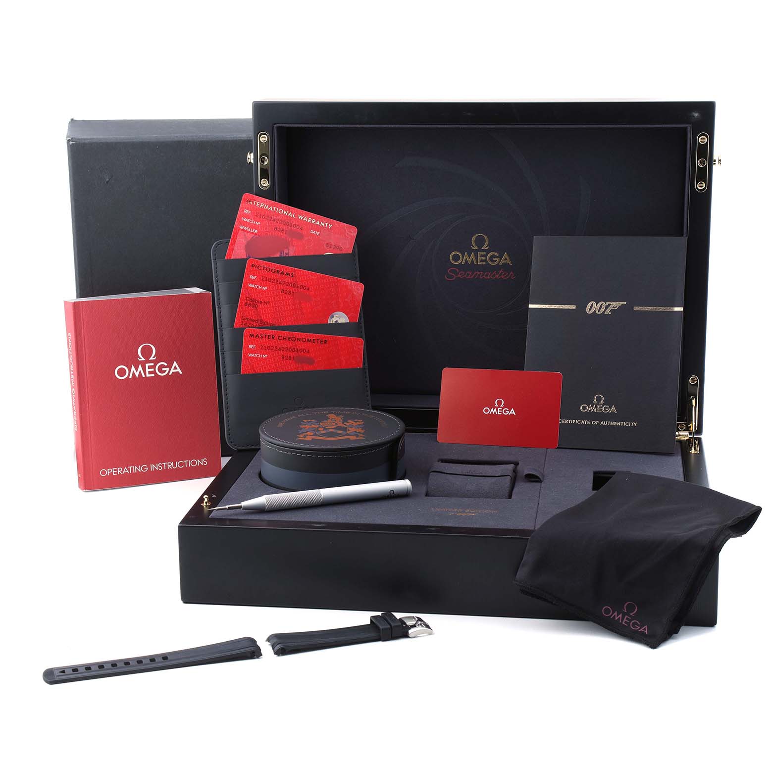 The image shows an Omega Seamaster 210.22.42.20.01.004 Men's Stainless Steel Black Dial watch set, including manuals, warranty cards, straps, a pen, and a storage box, viewed from above.