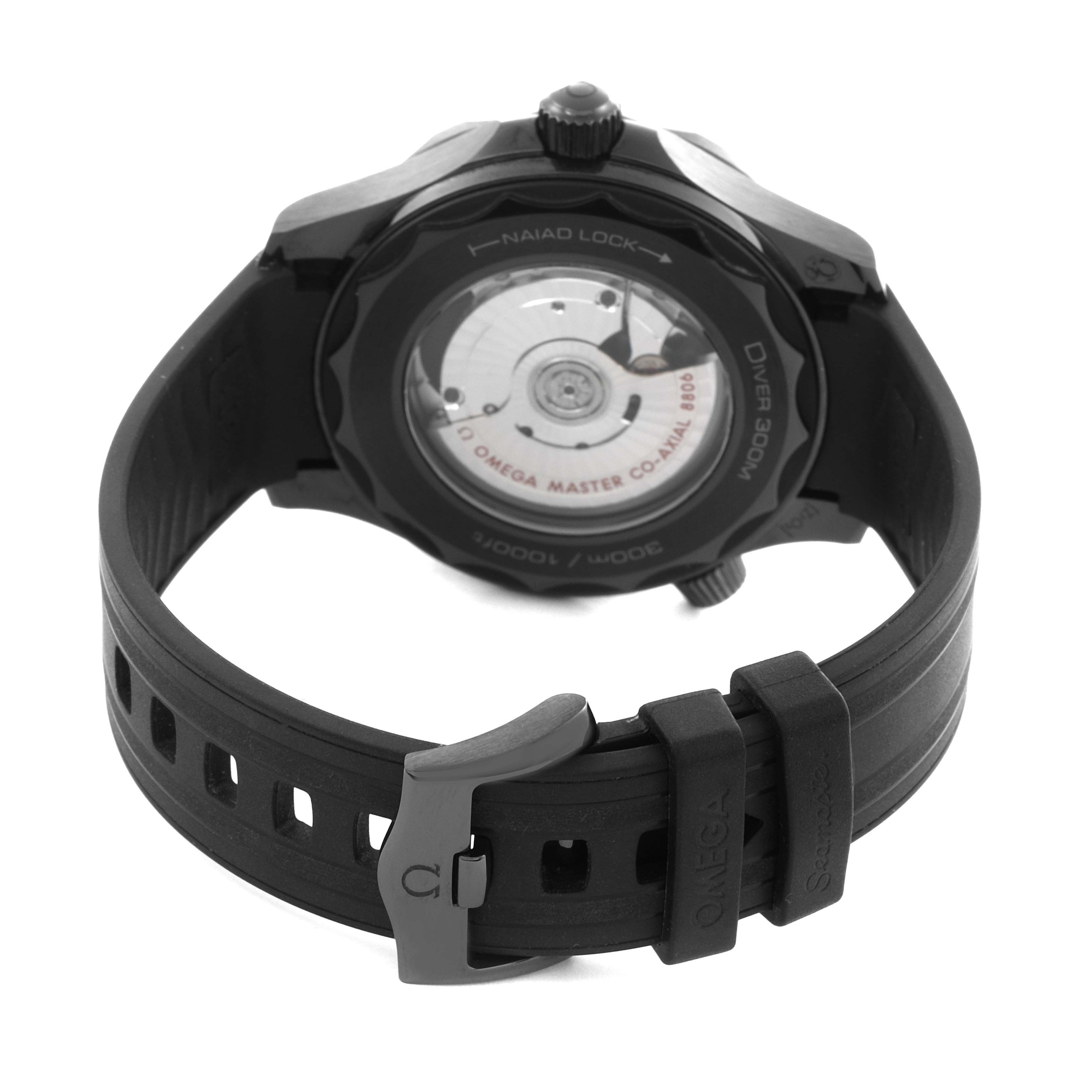 The image shows the back of the Omega Seamaster 210.92.44.20.01.003 Men's Ceramic Black Dial 210.92.44.20.01.003 Men's Ceramic Black Dial, highlighting the exposed movement and rubber strap with the buckle.