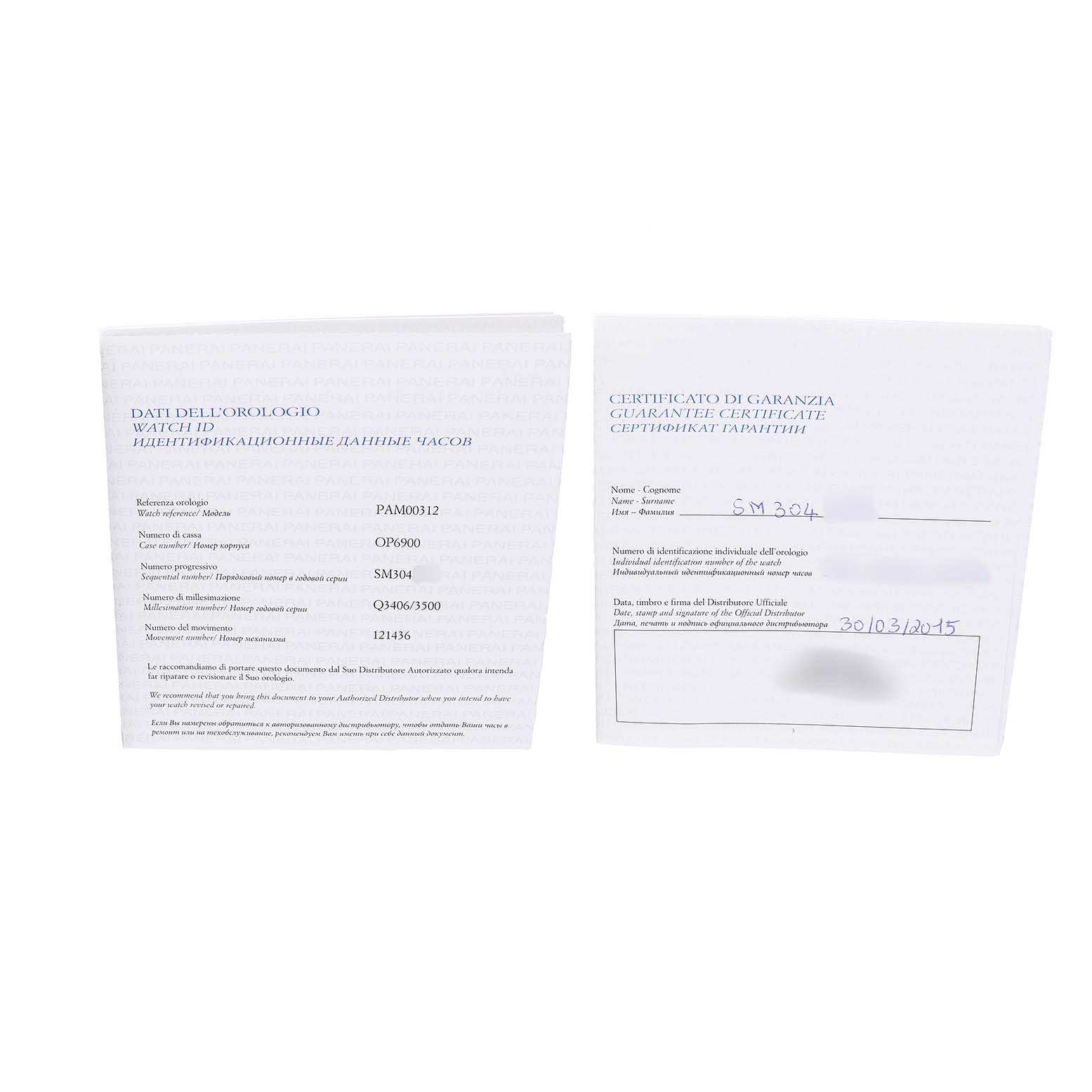 The image shows the warranty and information booklets for a Panerai Luminor PAM00312 Men's Stainless Steel Black Dial watch, viewed from the top.