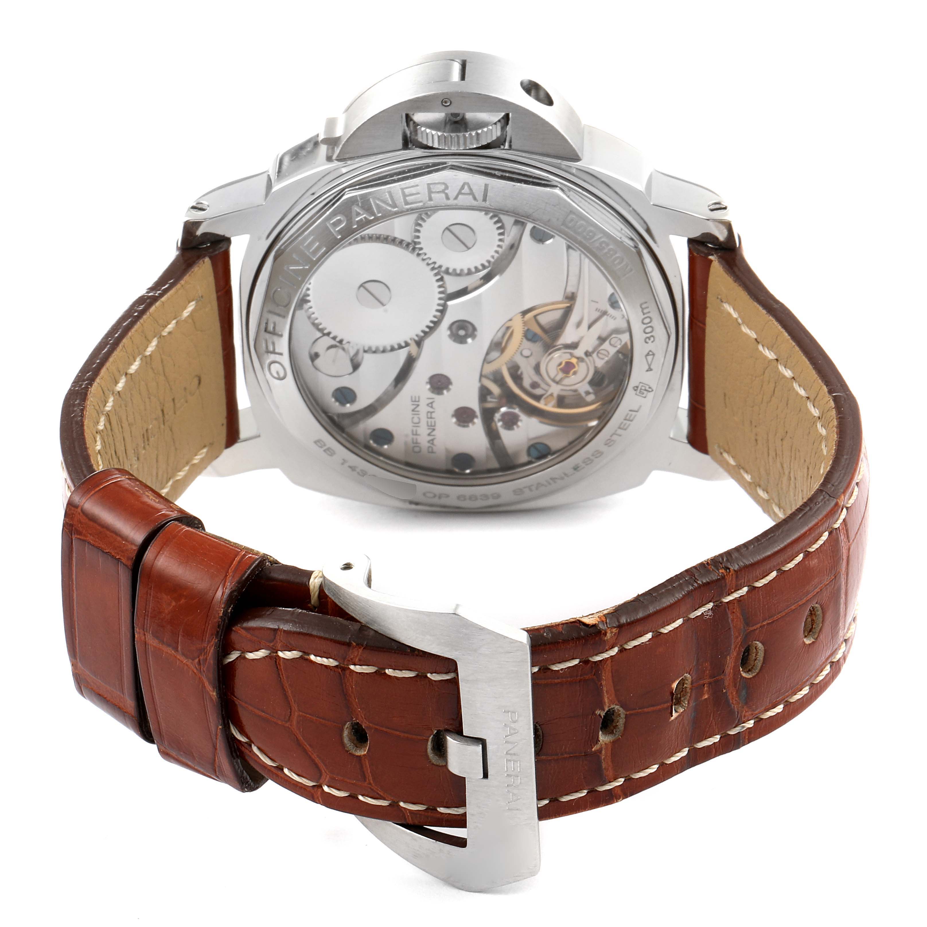 This image shows the back view of a Panerai Luminor PAM00219 Men's Stainless Steel Black Dial PAM00219 Men's Stainless Steel Black Dial watch, highlighting its intricate movement and brown leather strap with stitching.