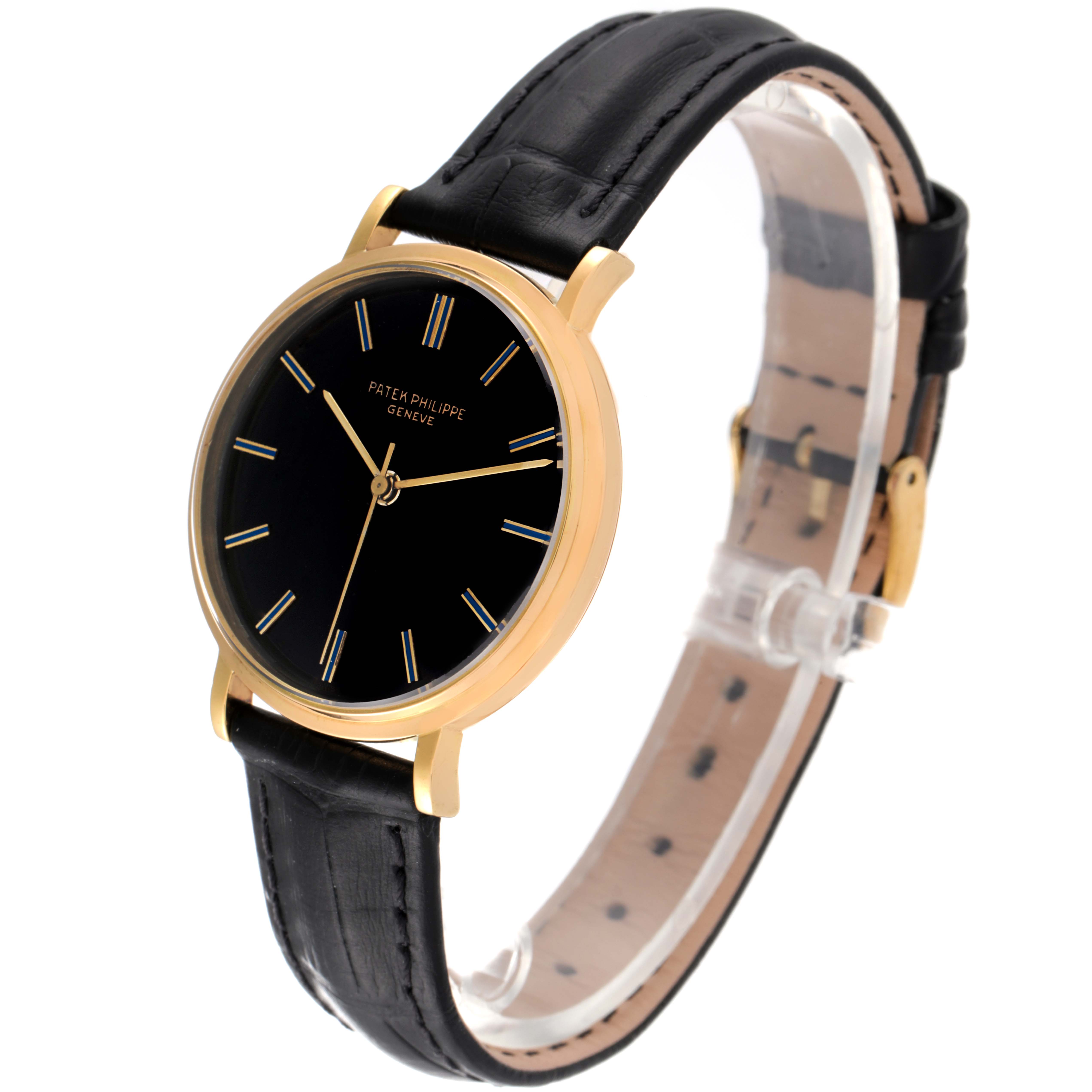 The image shows a side view of a Patek Philippe Calatrava 3569 Men's Yellow Gold Black Dial 3569 Men's Yellow Gold Black Dial watch, highlighting its black leather strap, gold case, and black dial.