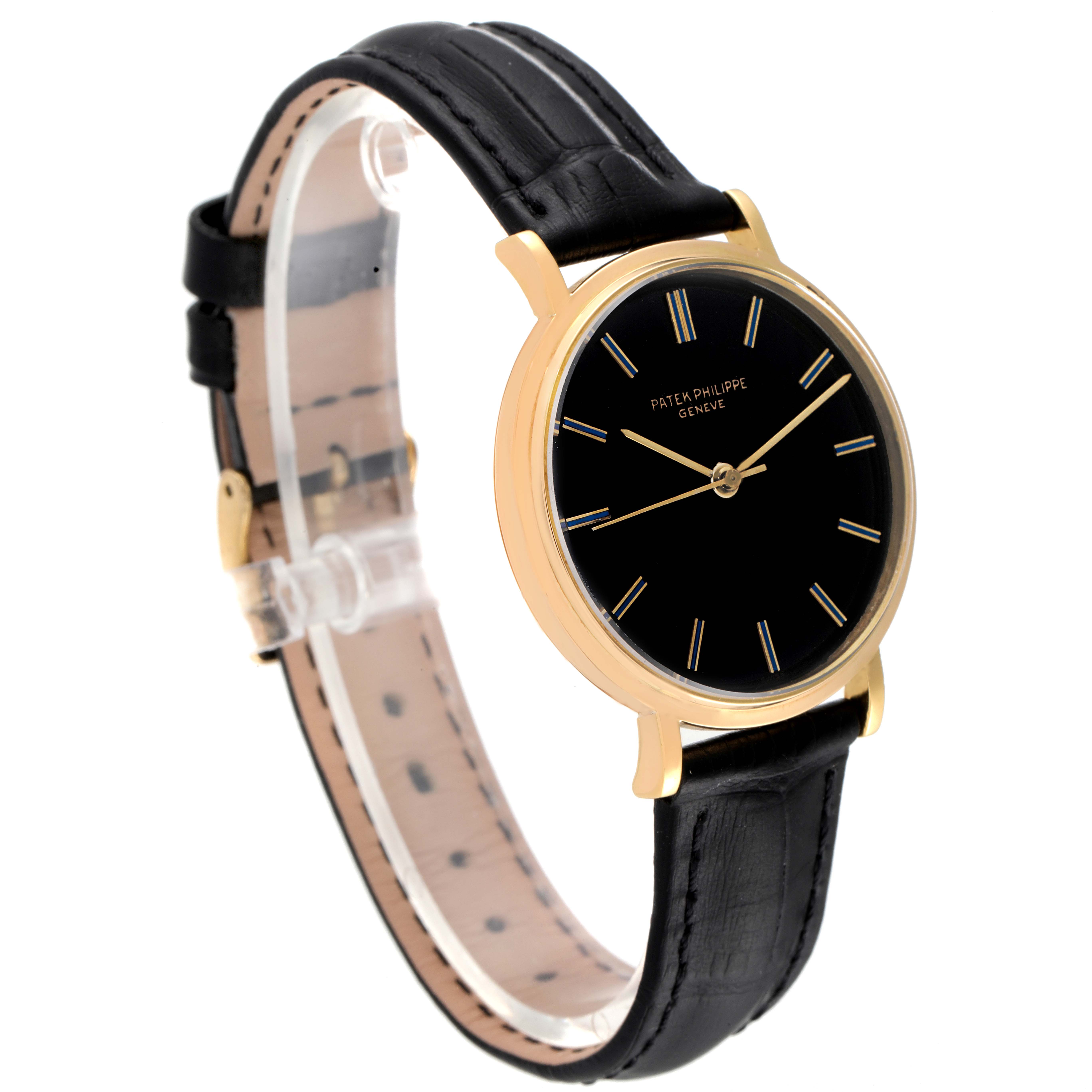 The Patek Philippe Calatrava 3569 Men's Yellow Gold Black Dial 3569 Men's Yellow Gold Black Dial watch is shown at a three-quarter angle, highlighting its black dial, gold case, and black leather strap.