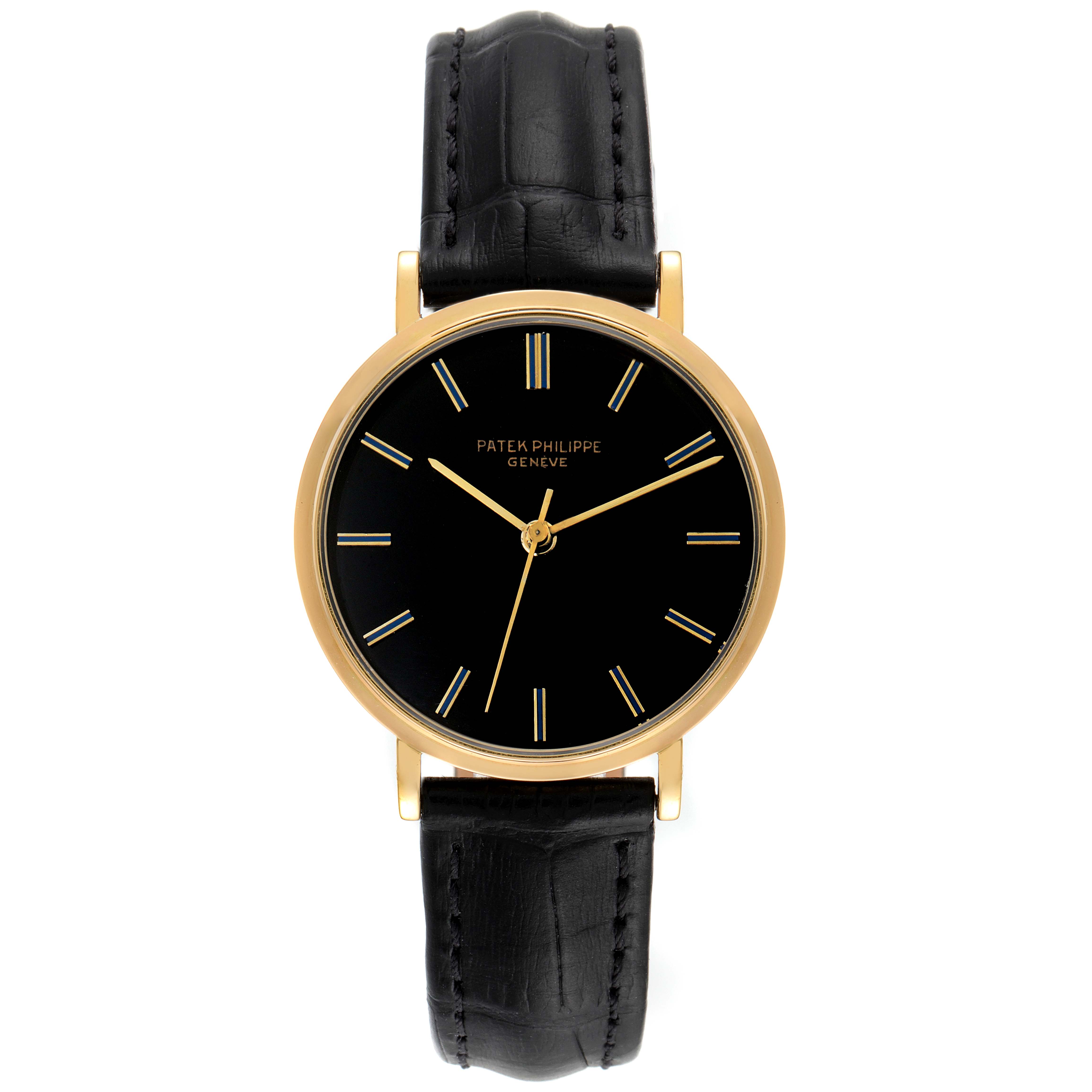 The image shows a front view of a Patek Philippe Calatrava 3569 Men's Yellow Gold Black Dial 3569 Men's Yellow Gold Black Dial watch displaying its black dial, gold case, and black leather strap.