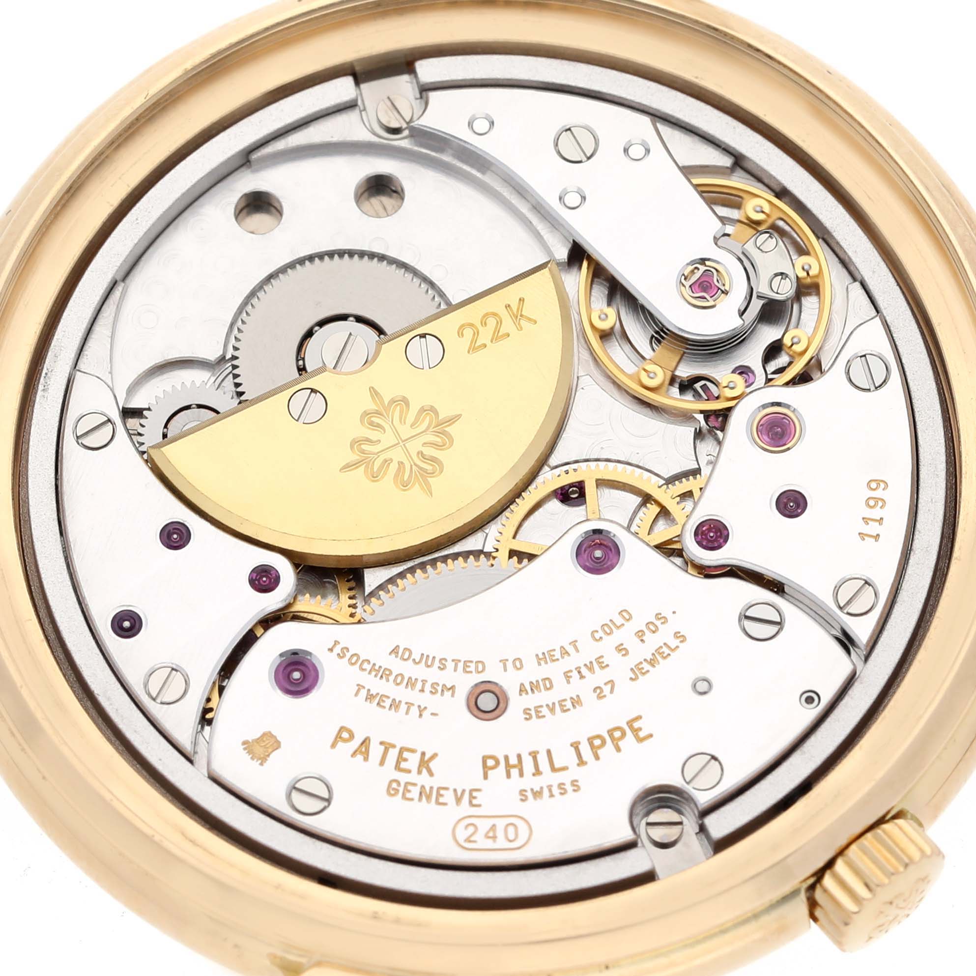 The image shows the back view of the Patek Philippe Calatrava 5032 Men's Yellow Gold Silver Dial 5032 Men's Yellow Gold Silver Dial watch, revealing its intricate movement and internal components.