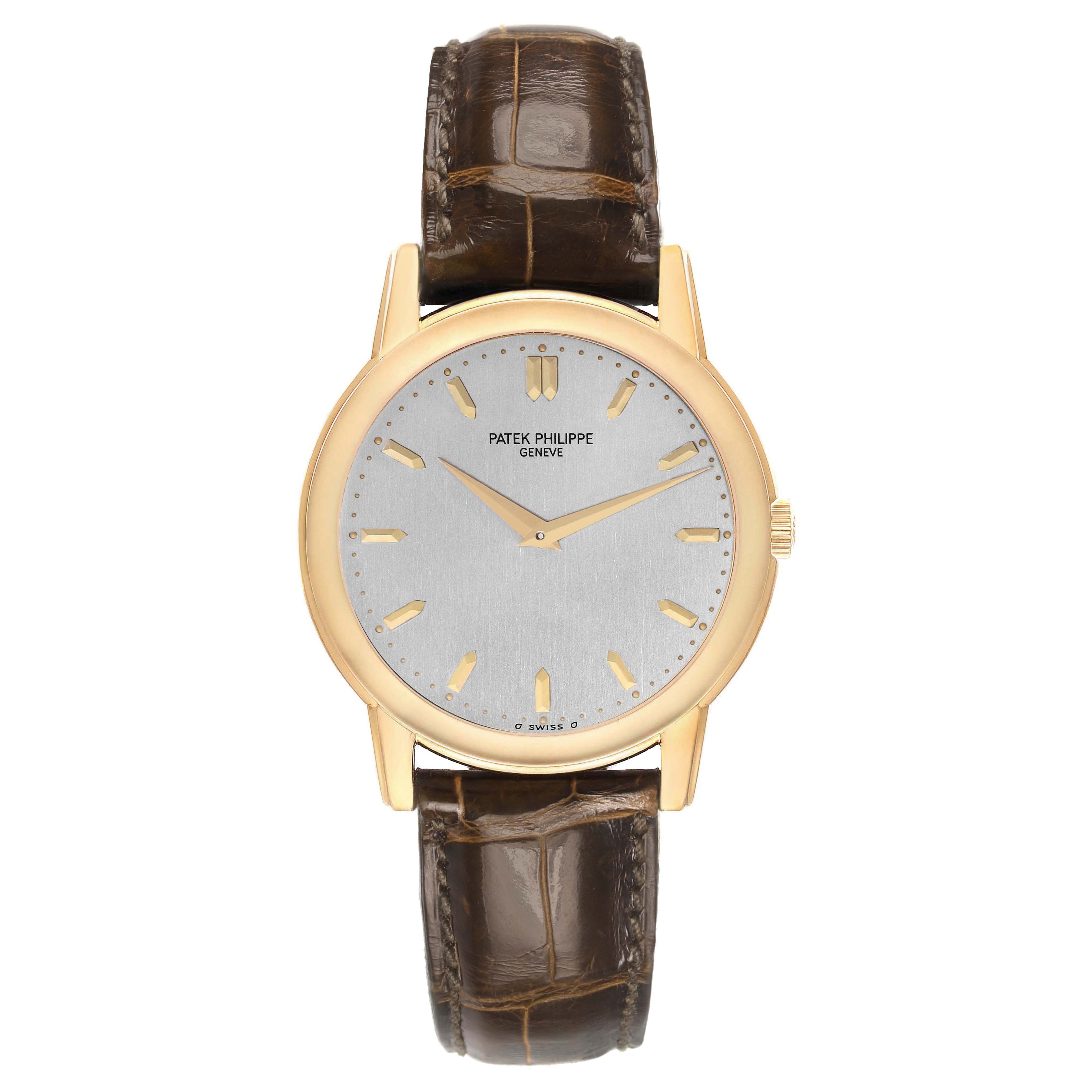 The Patek Philippe Calatrava 5032 Men's Yellow Gold Silver Dial watch is shown from a front angle, highlighting the face, case, and brown leather strap.