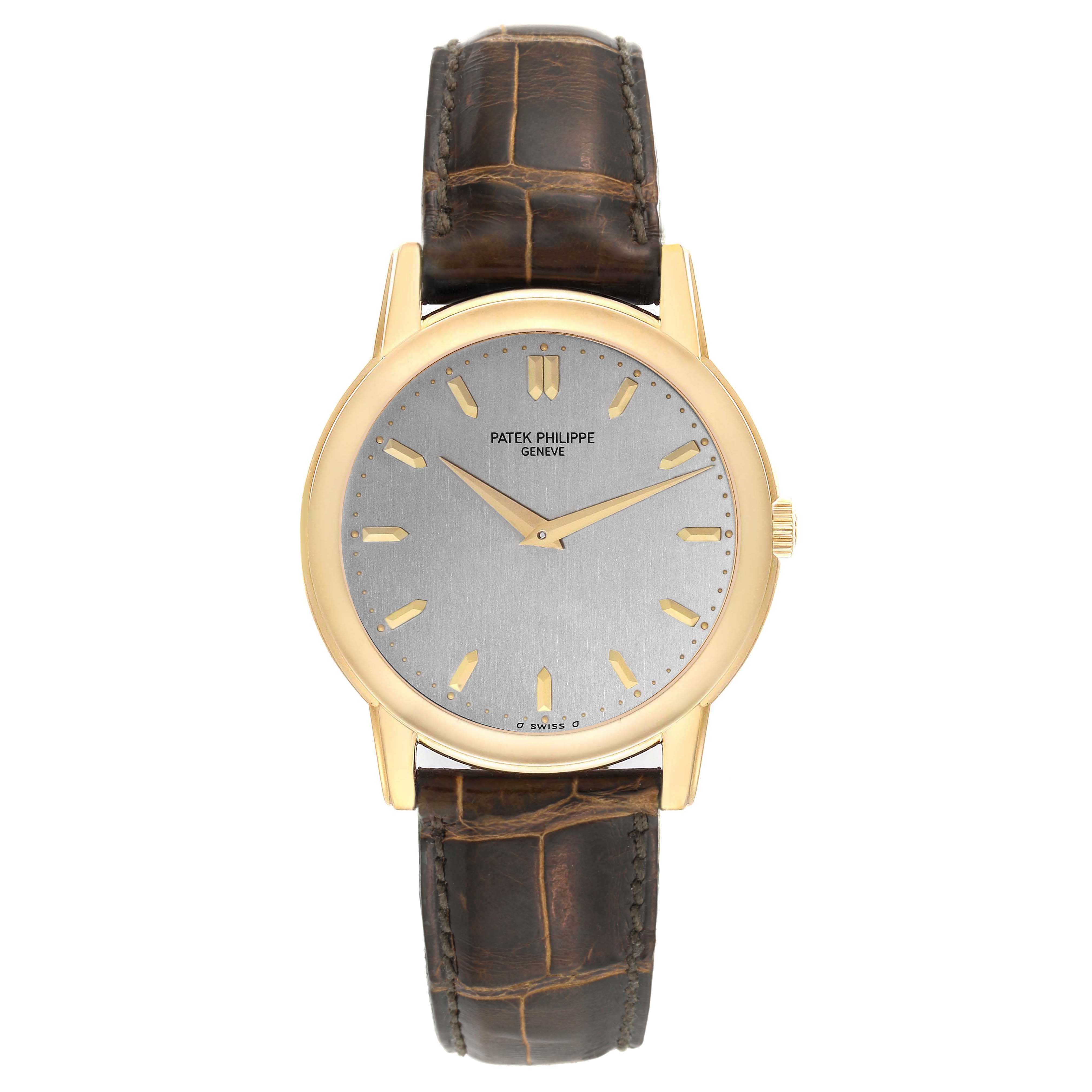 The Patek Philippe Calatrava 5032 Men's Yellow Gold Silver Dial 5032 Men's Yellow Gold Silver Dial watch is shown from a front angle, displaying the entire face, case, and leather strap.