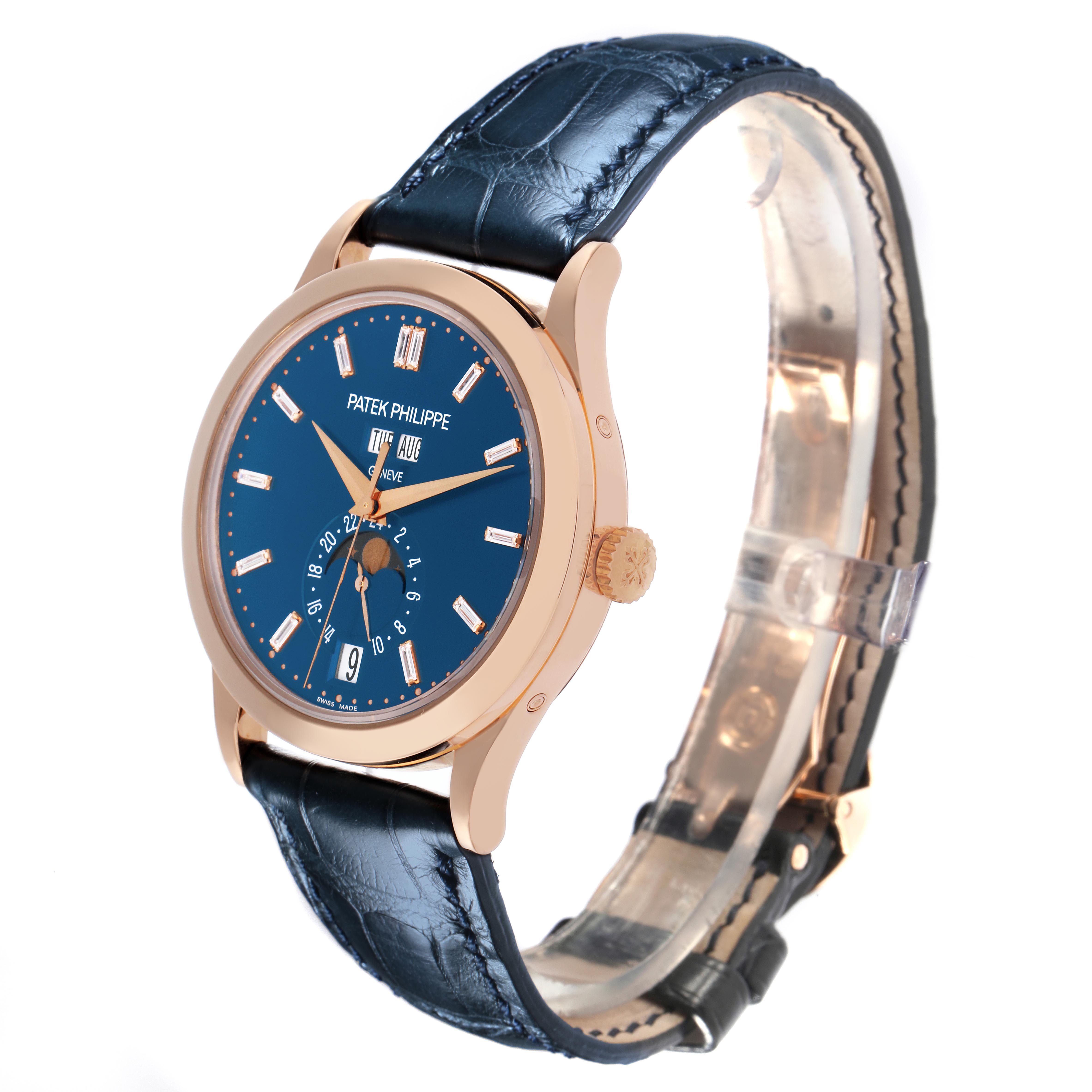 The Patek Philippe Complications 5396R-014 Men
s Rose Gold Blue Dial 5396R-014 Men
s Rose Gold Blue Dial watch is shown at a three-quarter angle, highlighting the blue dial, gold case, crown, and leather strap.