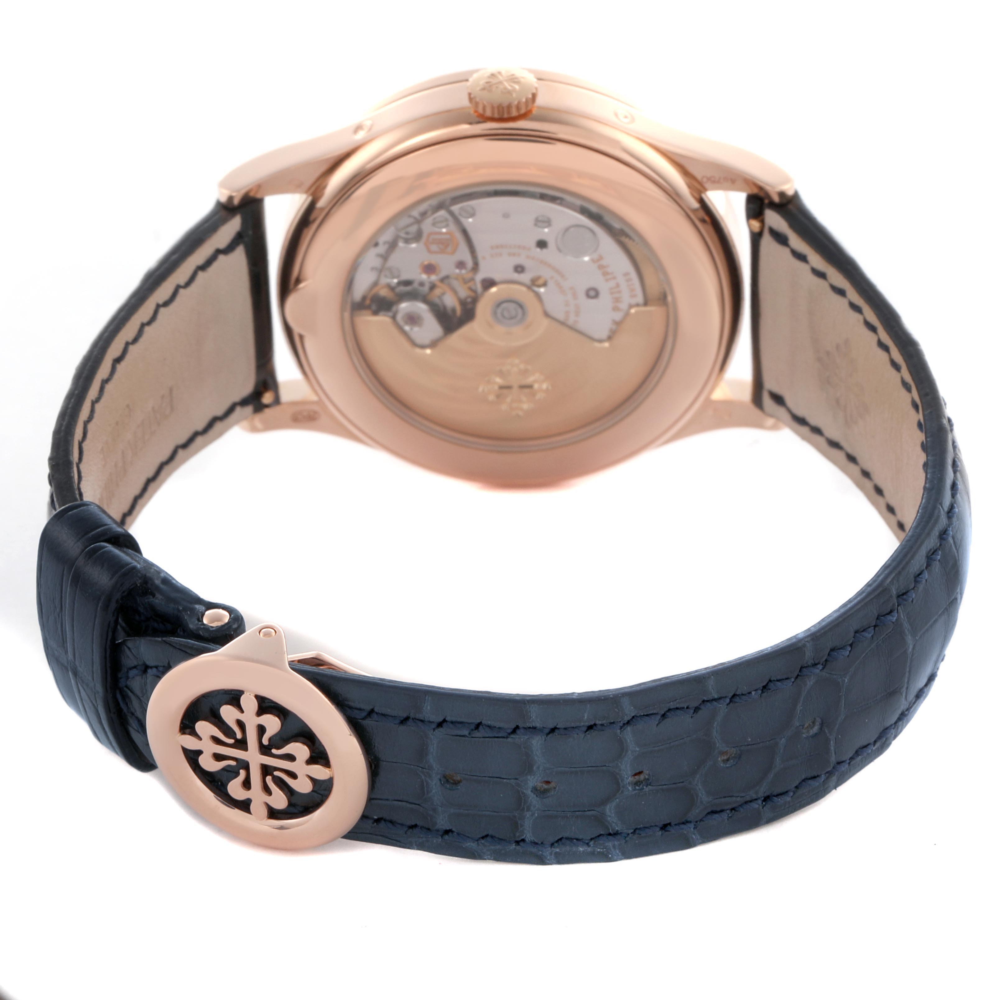 The image shows the back of a Patek Philippe Complications 5396R-014 Men
s Rose Gold Blue Dial 5396R-014 Men
s Rose Gold Blue Dial watch, highlighting the movement through a transparent case back and its clasp.