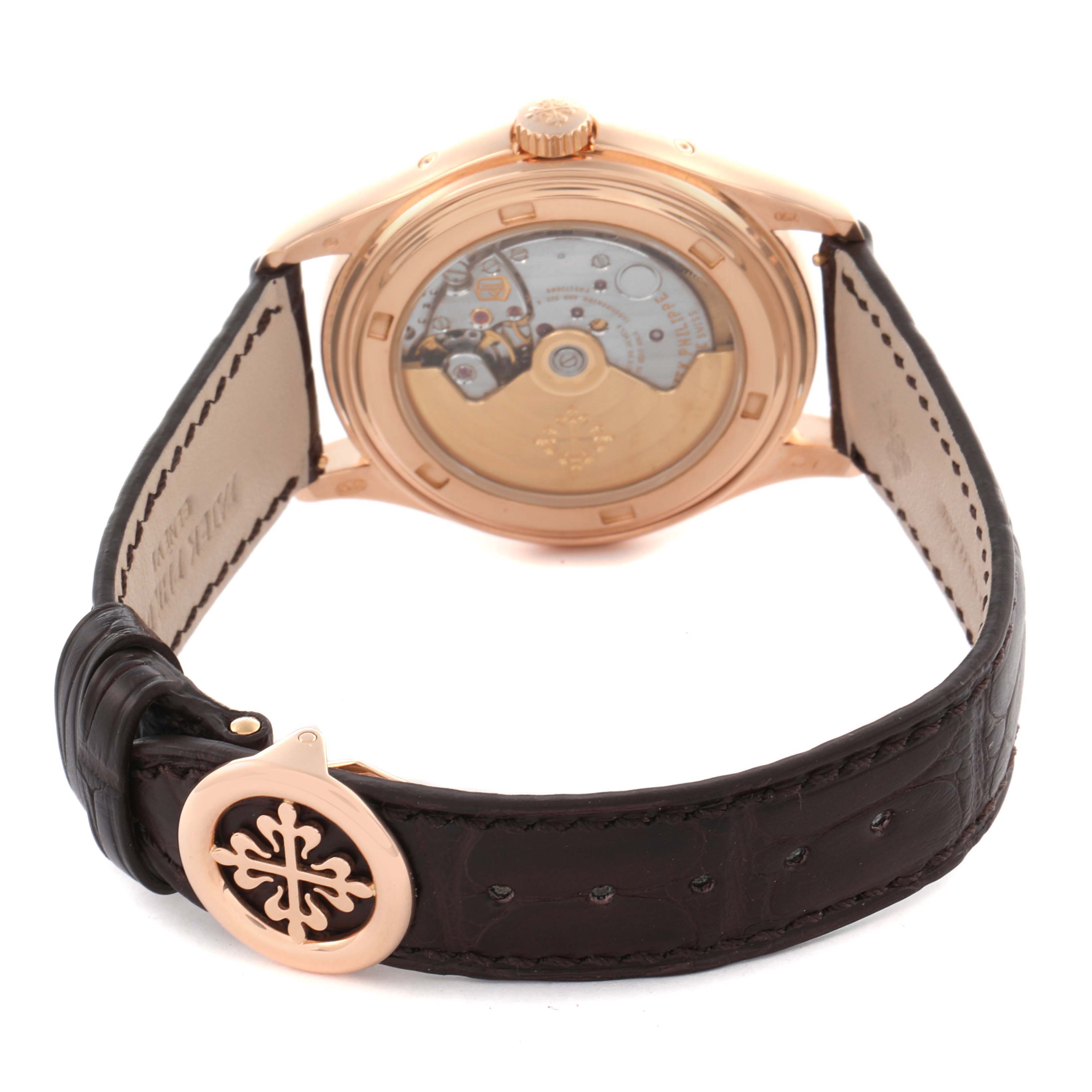 The image shows the back of a Patek Philippe Complications 5146R Men's Rose Gold Beige Dial 5146R Men's Rose Gold Beige Dial watch, highlighting its leather strap and visible movement.