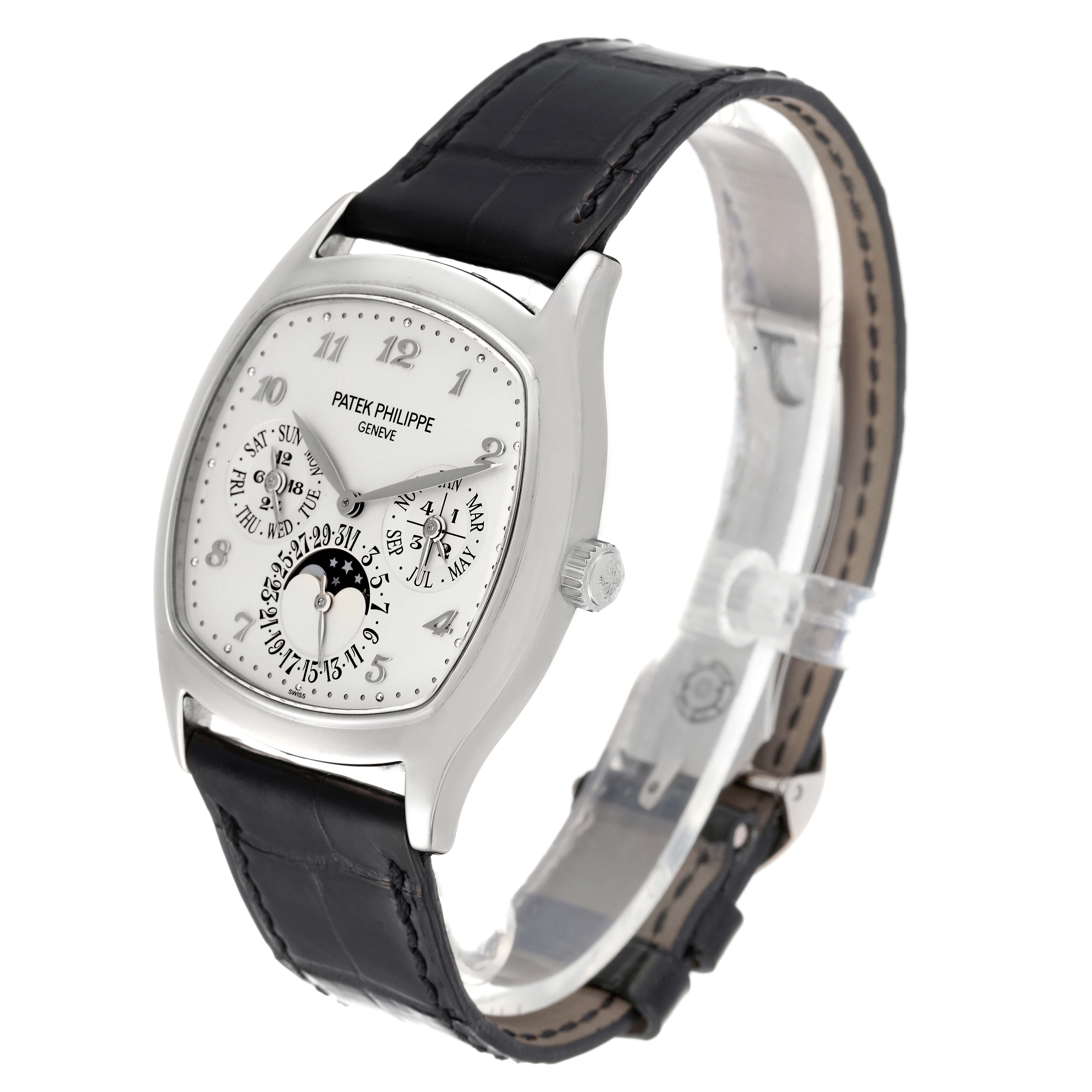 The image shows a Patek Philippe Complications 5940G - 001 Men
s White Gold Silver Dial 5940G - 001 Men
s White Gold Silver Dial watch at a three-quarter angle, highlighting the face, strap, and side crown.