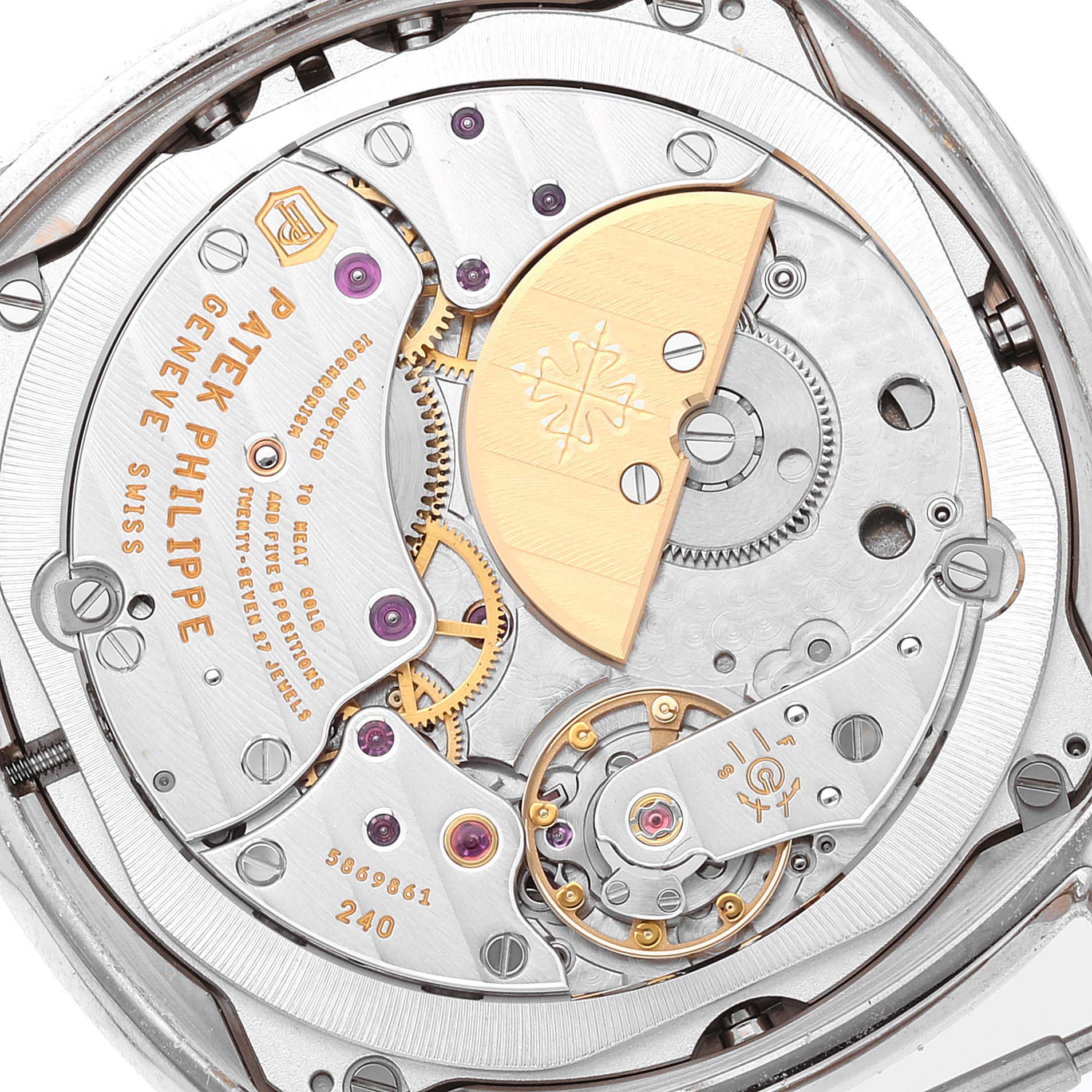 The image shows a detailed close-up of the movement mechanism of a Patek Philippe Complications 5940G - 001 Men
s White Gold Silver Dial 5940G - 001 Men
s White Gold Silver Dial watch.