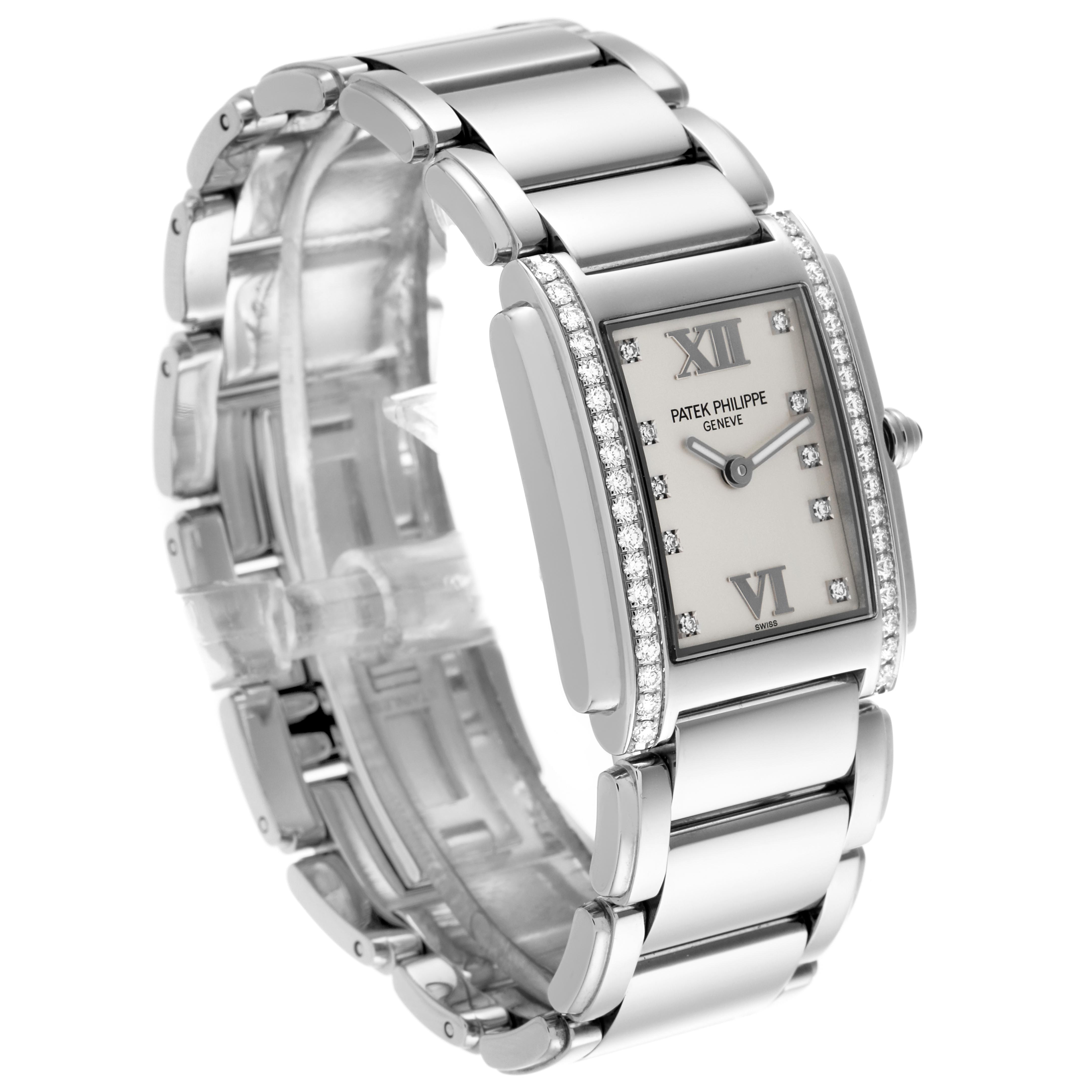 The Patek Philippe Twenty-4 4910/10A Women's Stainless Steel Silver Dial 4910/10A Women's Stainless Steel Silver Dial watch is shown at a three-quarter angle, displaying the face, bezel, crown, and part of the bracelet.