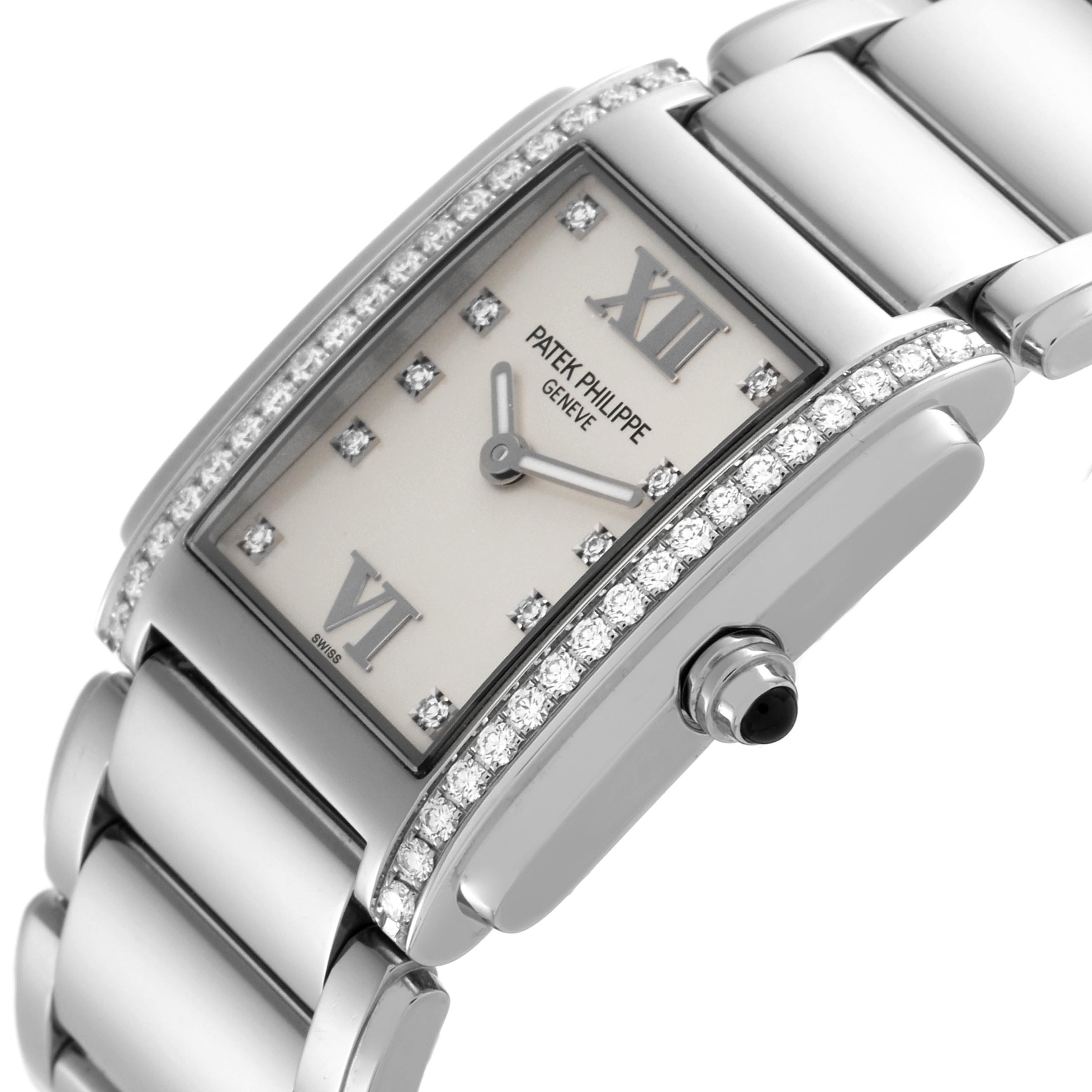 The Patek Philippe Twenty-4 4910/10A Women's Stainless Steel Silver Dial 4910/10A Women's Stainless Steel Silver Dial watch is shown at an angled side view, highlighting the diamond-set bezel, dial, and bracelet.