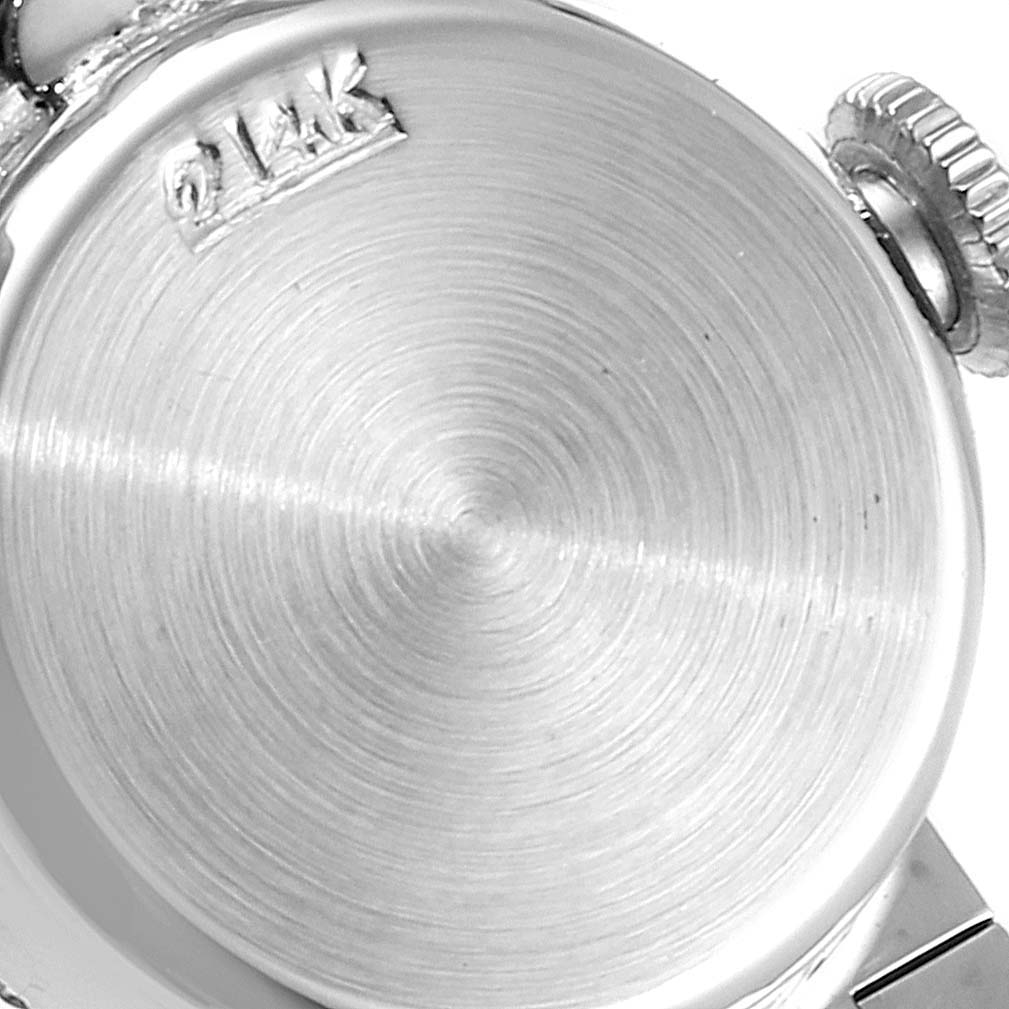 This image shows the back casing and crown of a Rolex Cocktail 4431 Women's White Gold Silver Dial 4431 Women's White Gold Silver Dial model watch at a close-up angle.