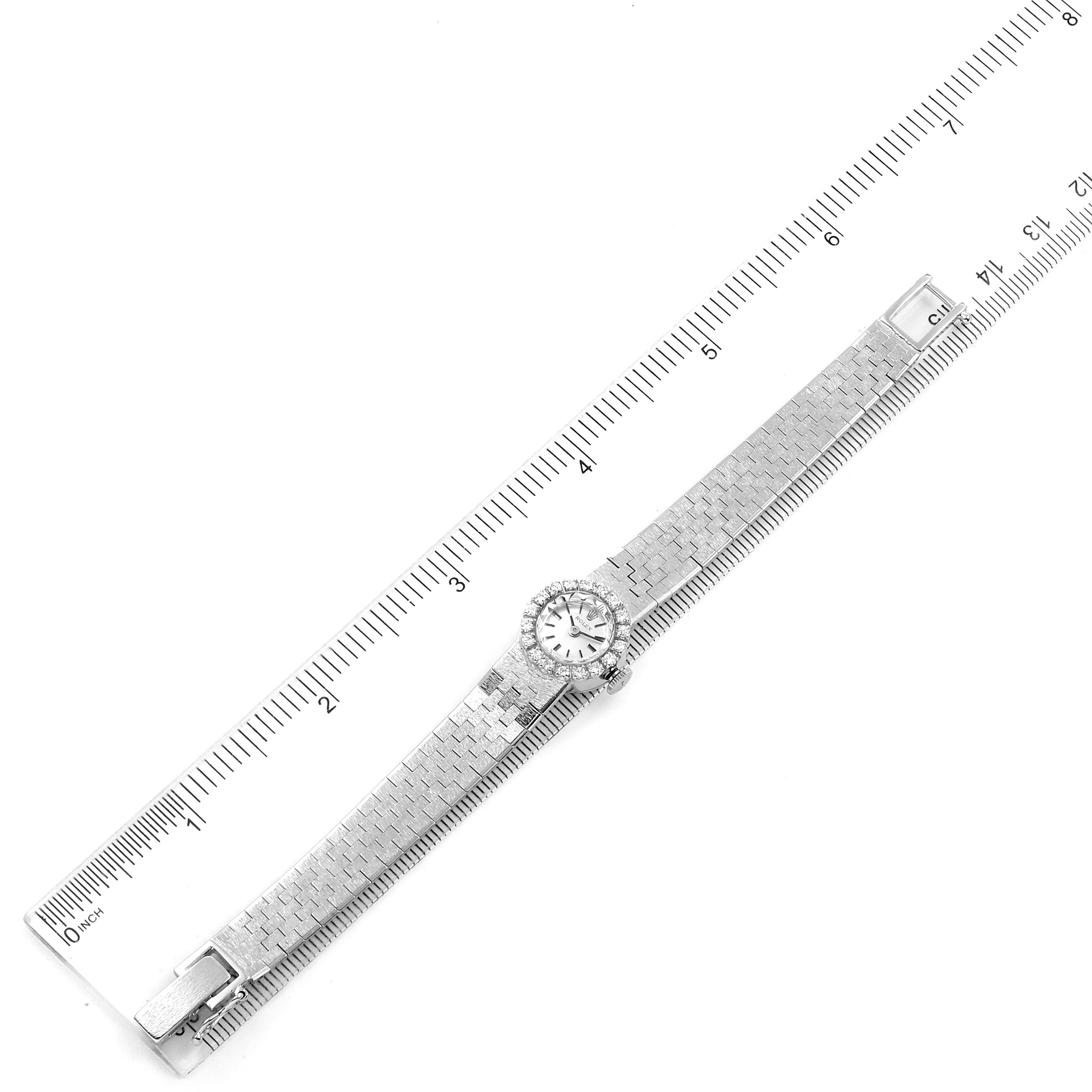 The image shows a top-down view of a Rolex Cocktail 4431 Women's White Gold Silver Dial 4431 Women's White Gold Silver Dial watch, laid adjacent to a ruler for size reference.