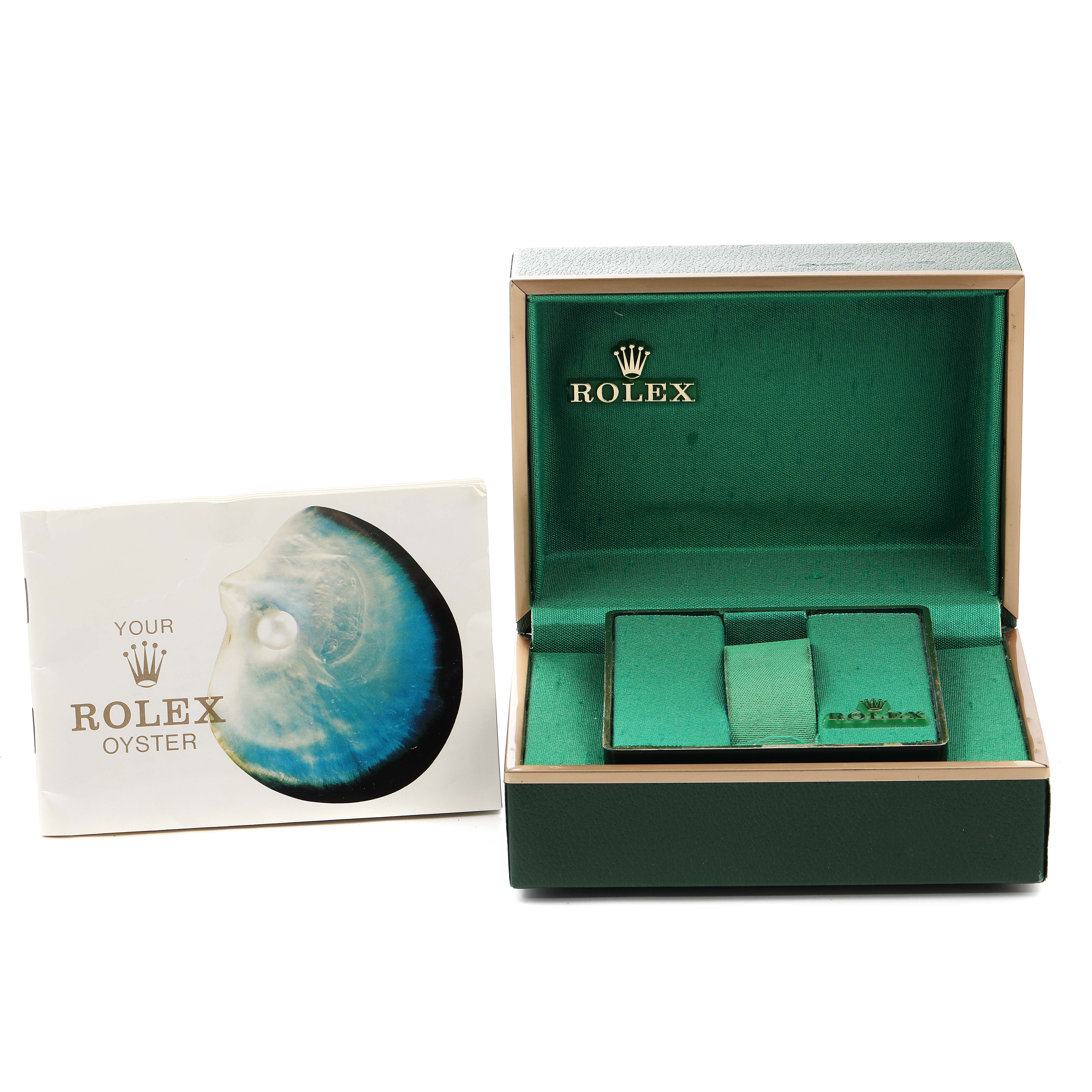 This image shows the open box with a booklet for the Rolex Vintage Collection 5700 Men's Stainless Steel Silver Dial 5700 Men's Stainless Steel Silver Dial watch, highlighting the packaging.