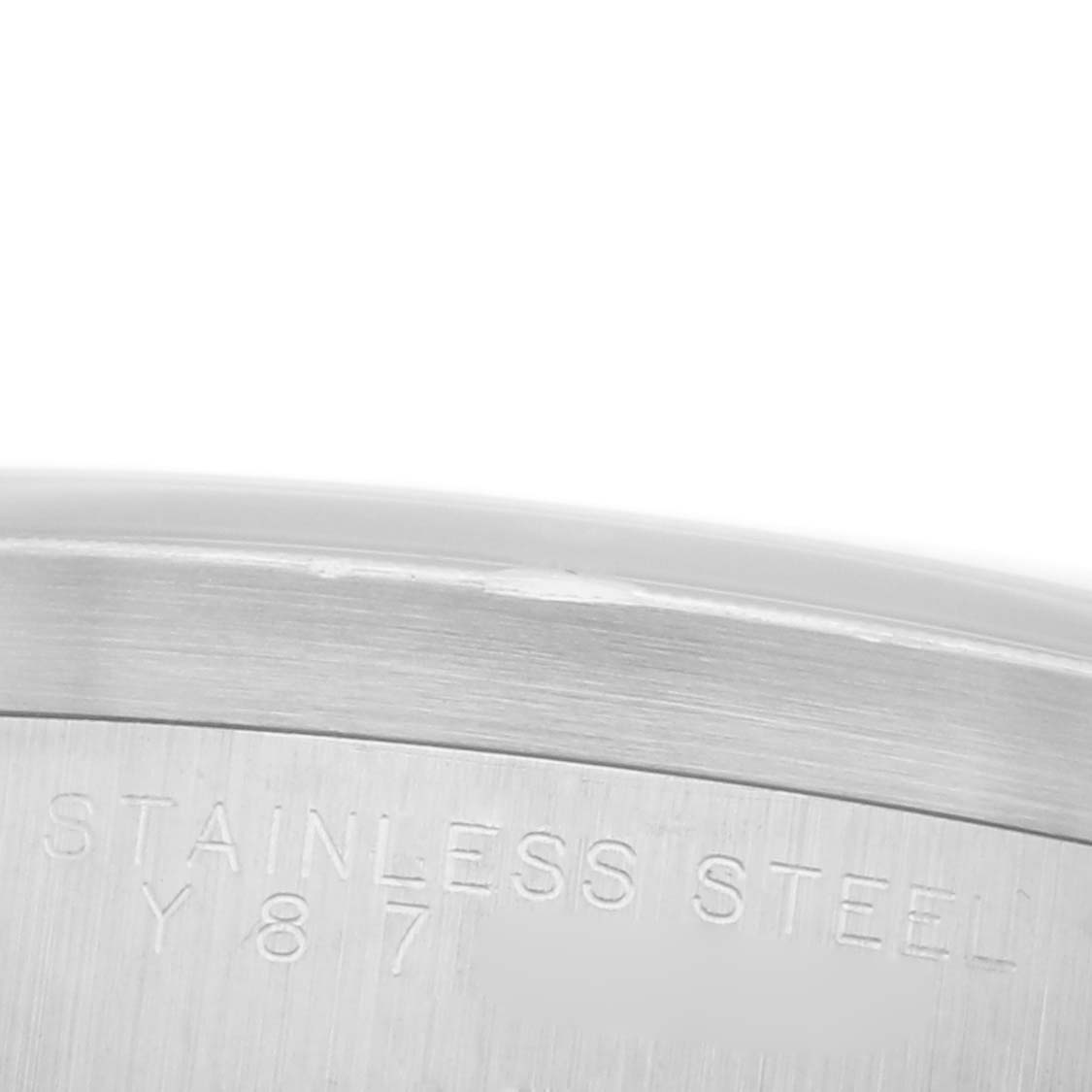 This image shows a close-up of the side of a Rolex Air-King 14010M Men's Stainless Steel Black Dial 14010M Men's Stainless Steel Black Dial watch case, highlighting the "Stainless Steel" engraving.