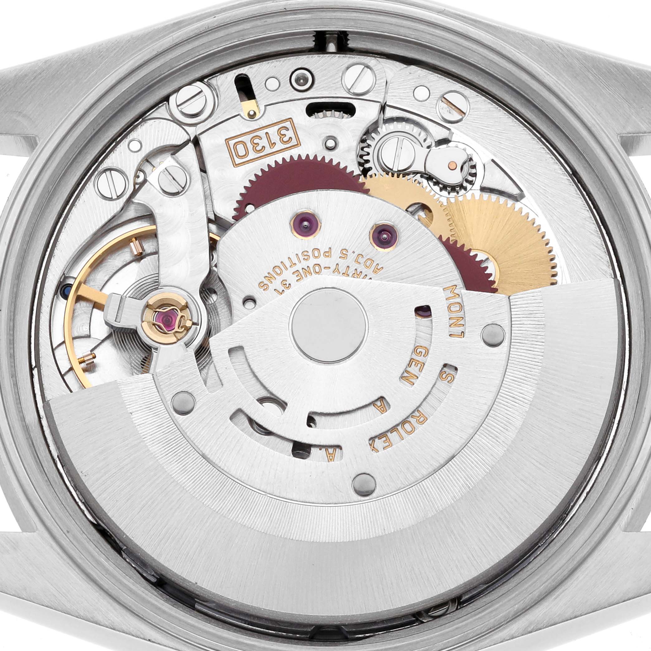 The image shows the movement of a Rolex Air-King 14010M Men's Stainless Steel Black Dial 14010M Men's Stainless Steel Black Dial watch from a top-down angle, highlighting gears and mechanisms inside.