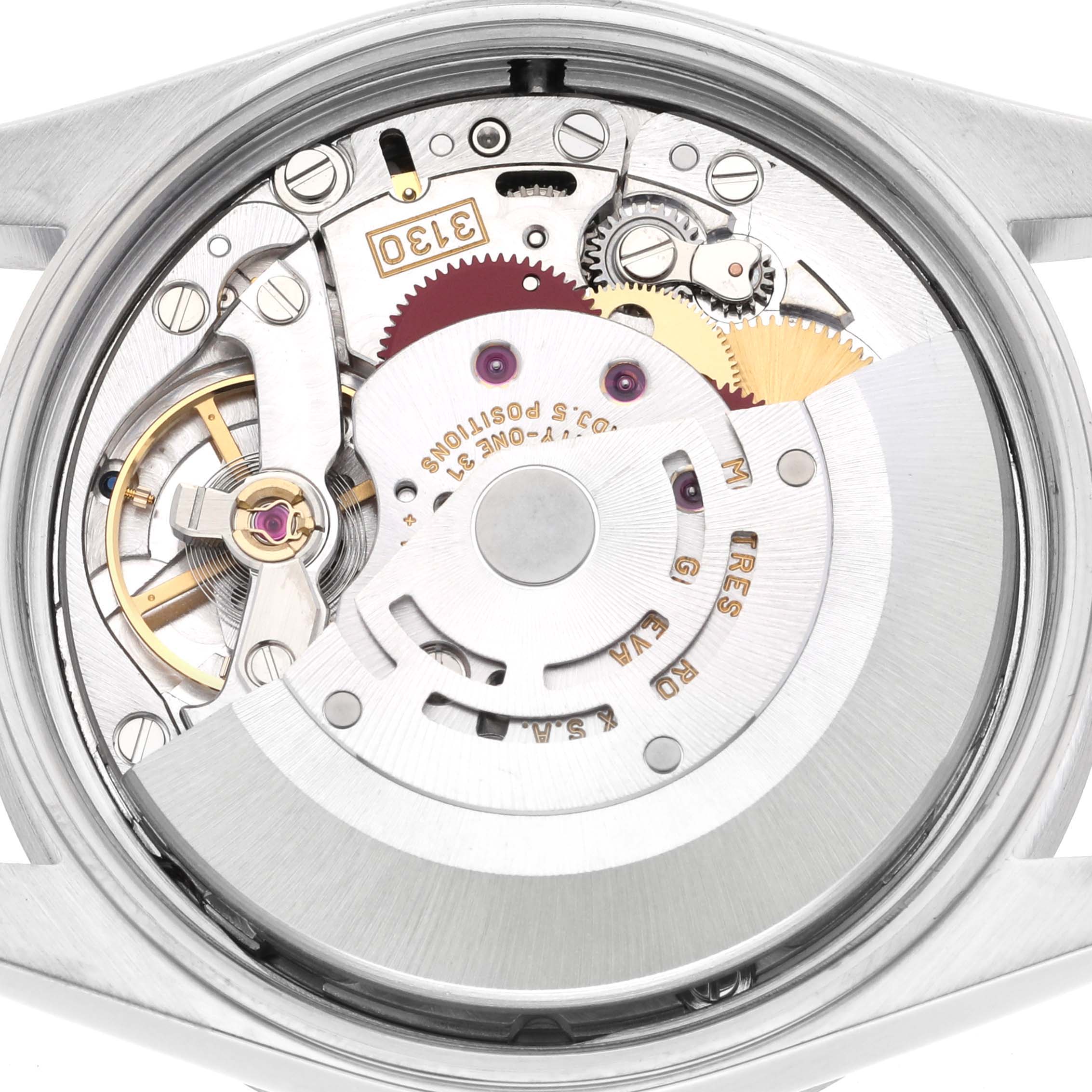 The image shows an internal close-up of the Rolex Air-King 14010 Men's Stainless Steel Silver Dial 14010 Men's Stainless Steel Silver Dial watch, revealing its detailed mechanical movement.