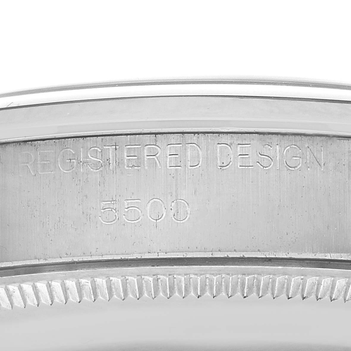The image shows a close-up of the engraved inner bezel and case edge of a Rolex Air-King 5500 Men's Stainless Steel Silver Dial 5500 Men's Stainless Steel Silver Dial watch.