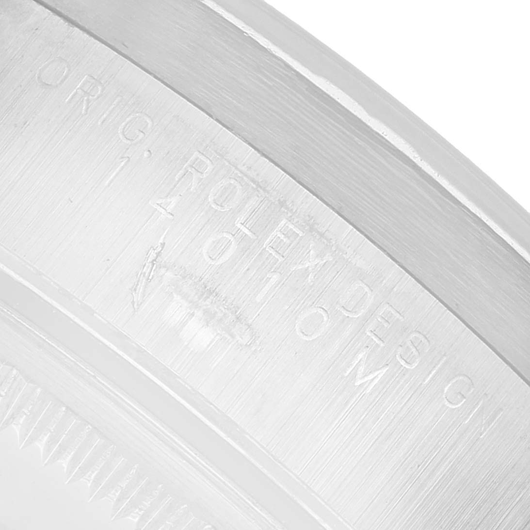 The image shows an angled close-up of the Rolex Air-King 14010 Men's Stainless Steel Silver Dial's inner bezel with engraved text.