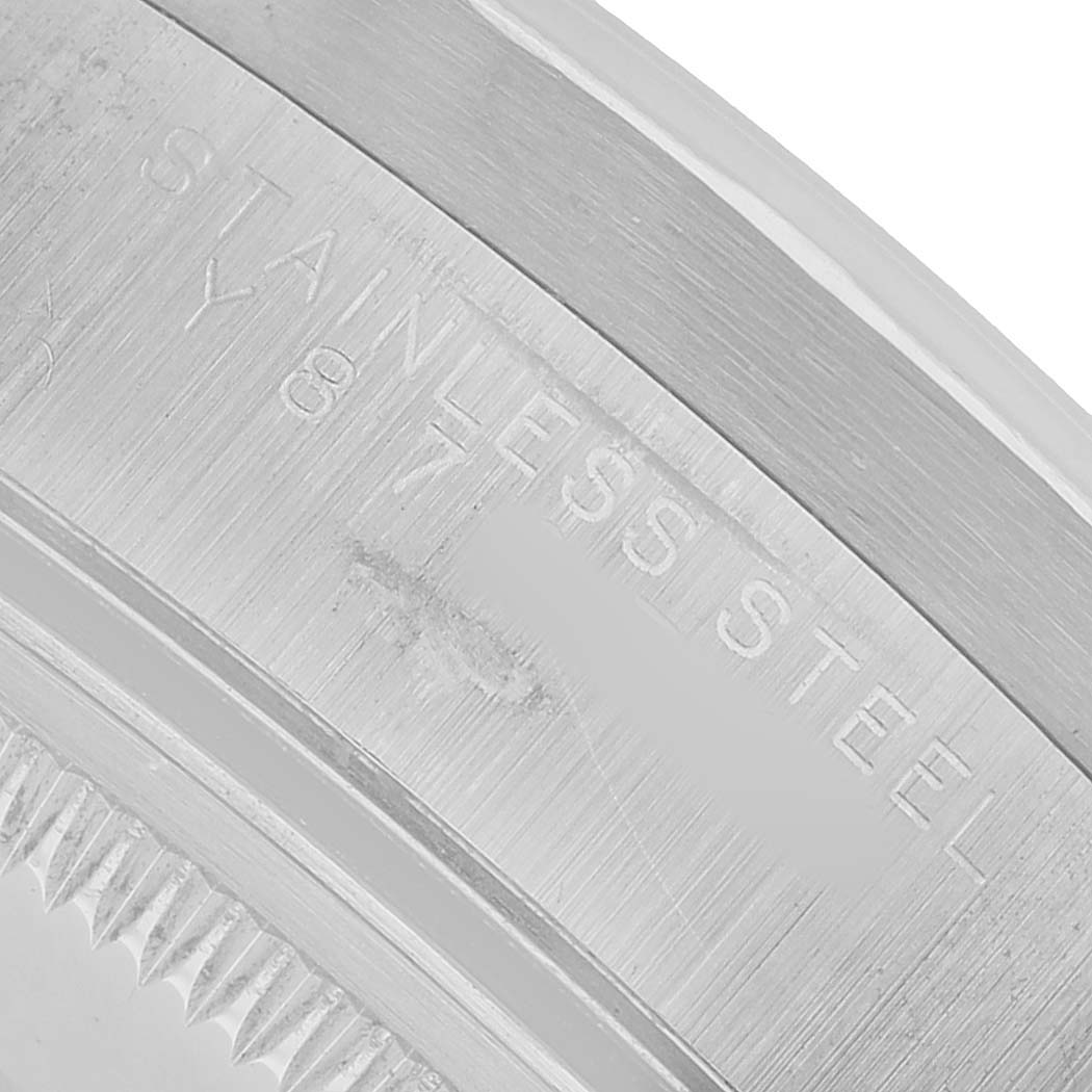 The image shows a close-up of the stainless steel case back edge of a Rolex Air-King 14010 Men's Stainless Steel Silver Dial watch.