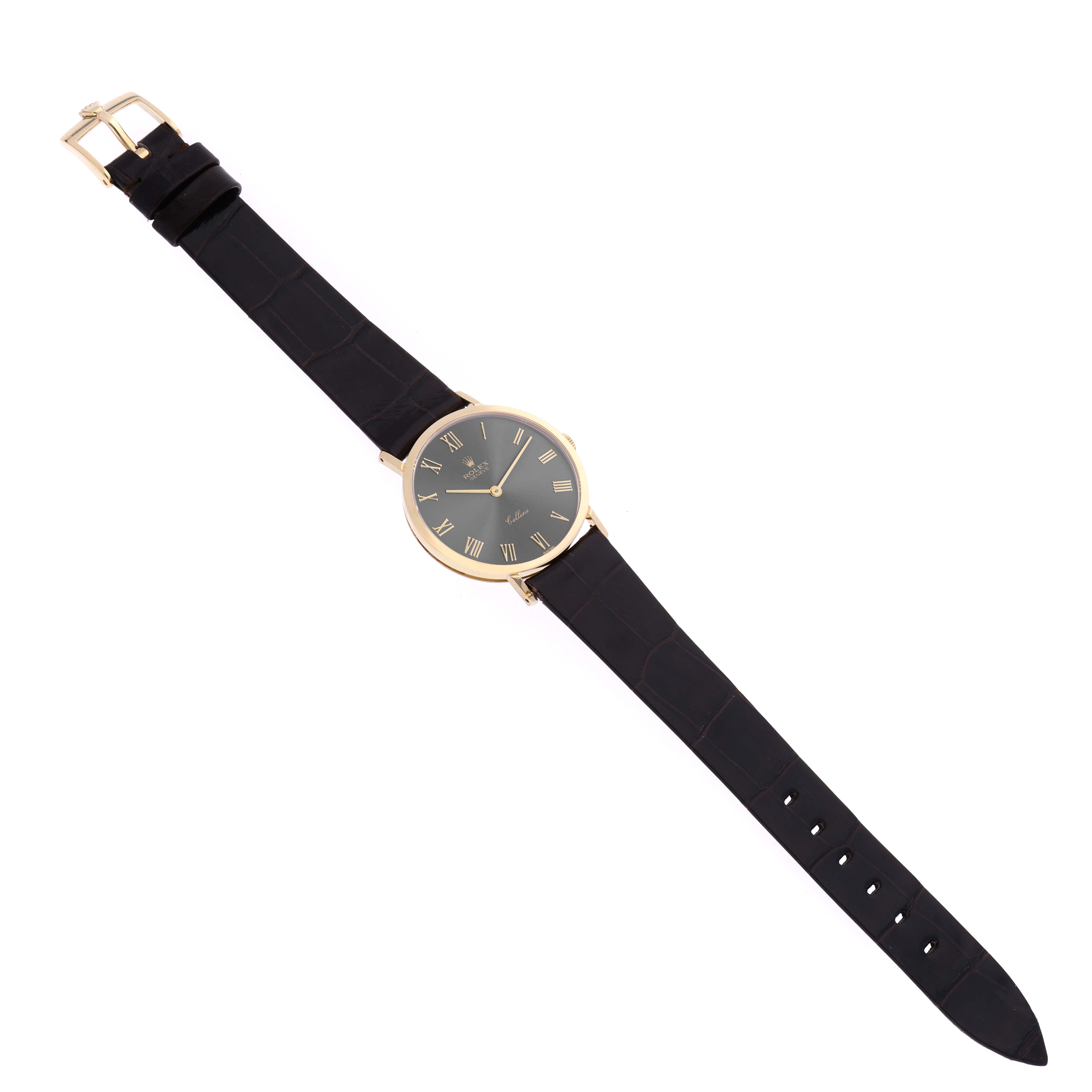 The Rolex Cellini 4112 Men's Yellow Gold Grey Dial 4112 Men's Yellow Gold Grey Dial watch is displayed flat, showing the black leather strap, gold case, and black dial with Roman numerals.