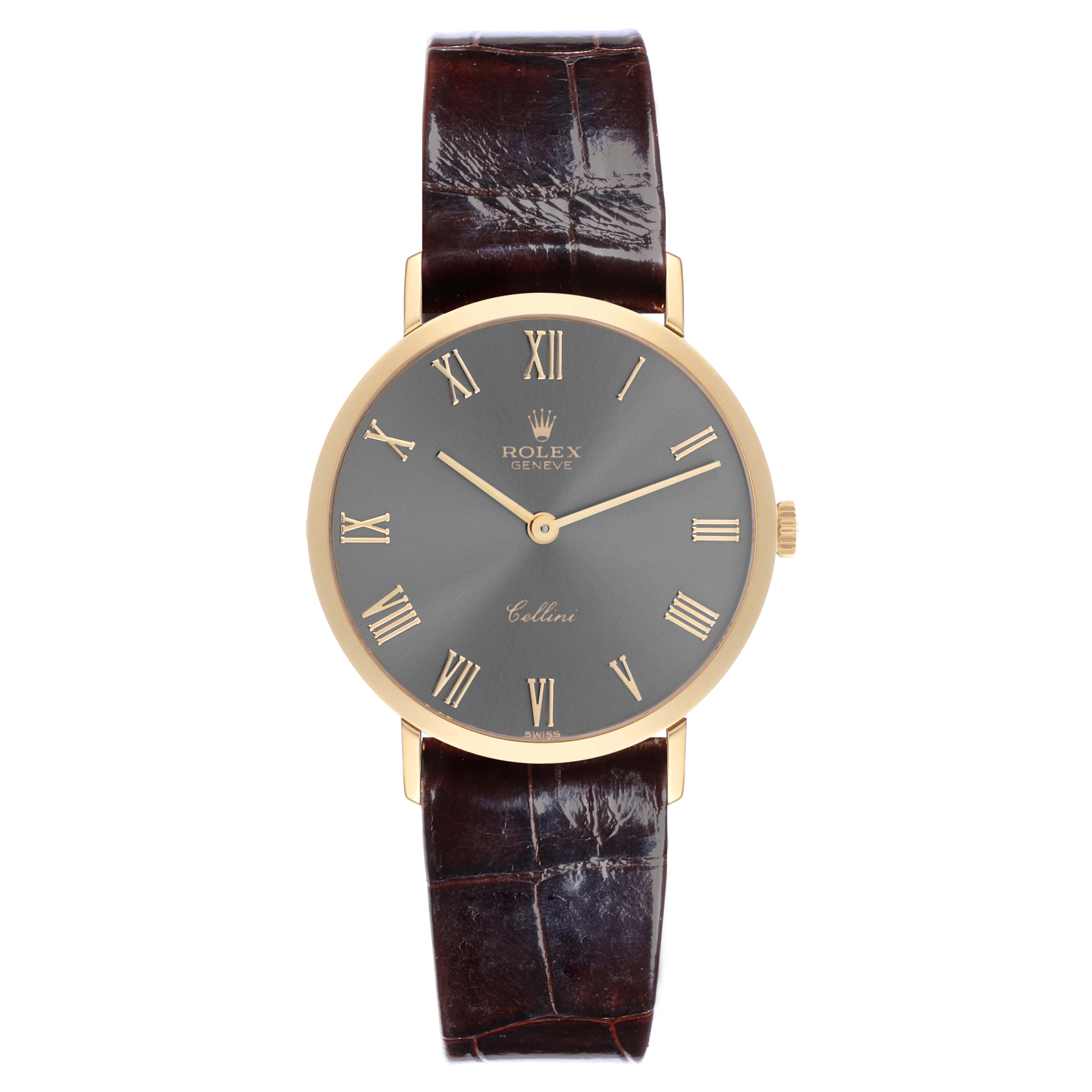 The Rolex Cellini 4112 Men's Yellow Gold Grey Dial 4112 Men's Yellow Gold Grey Dial watch is shown from the front, featuring a gold case, black dial with Roman numerals, and a brown leather strap.