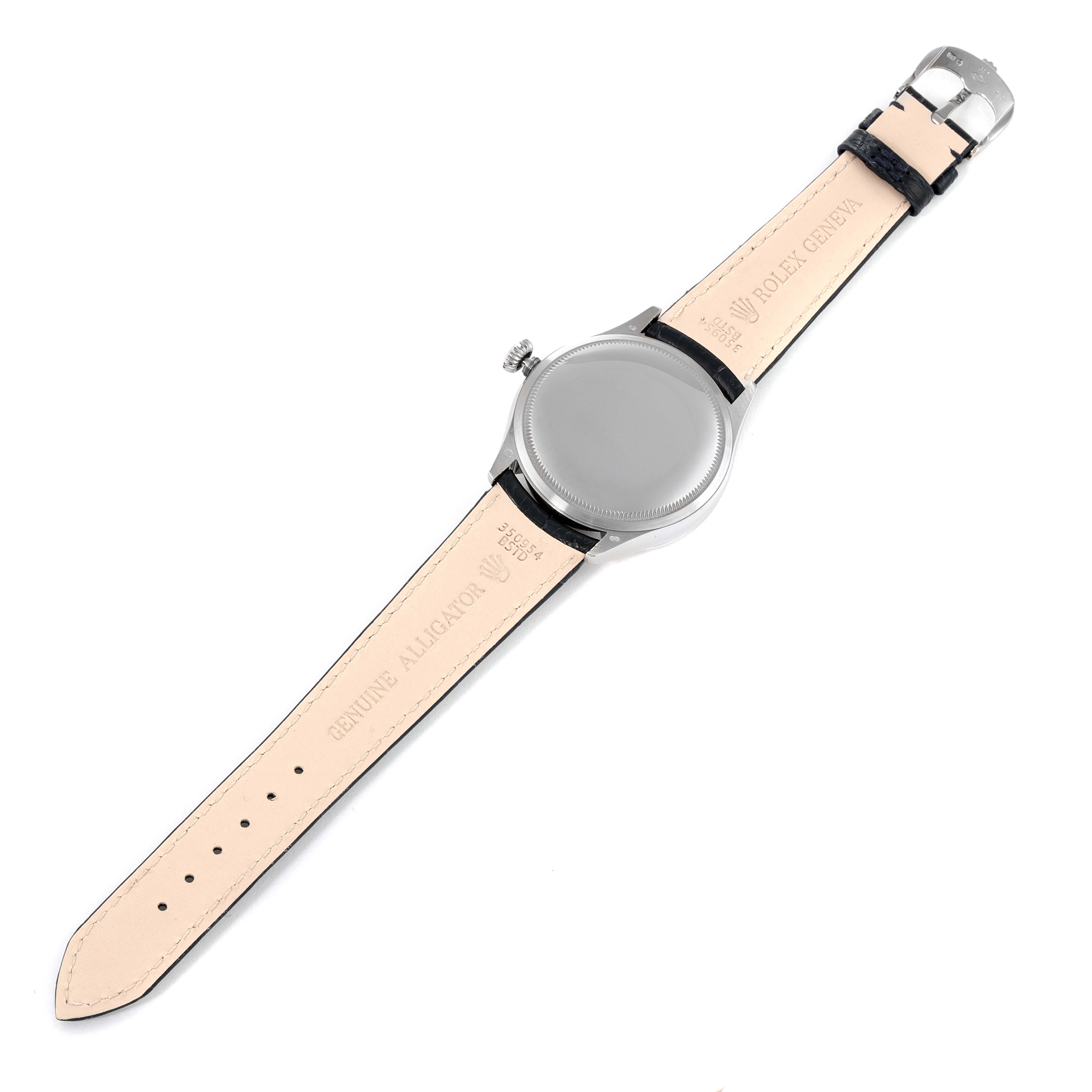 The image shows the back of a Rolex Cellini 50519 Men
s White Gold Blue Dial 50519 Men
s White Gold Blue Dial watch, displaying its case, leather strap, and clasp from a flat, top-down angle.