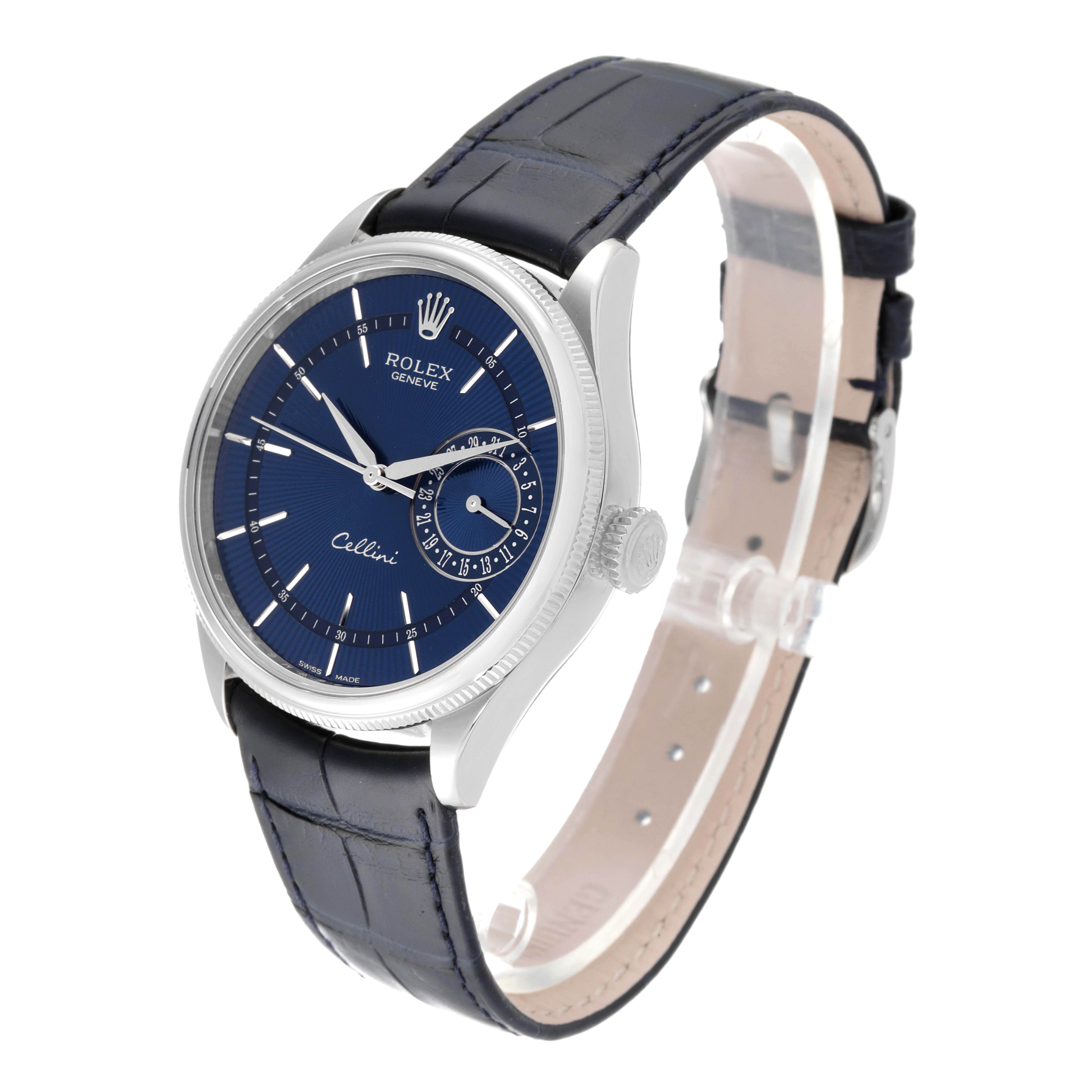 The image shows a Rolex Cellini 50519 Men
s White Gold Blue Dial 50519 Men
s White Gold Blue Dial watch at an angled side view, highlighting its blue dial, case, crown, and leather strap.