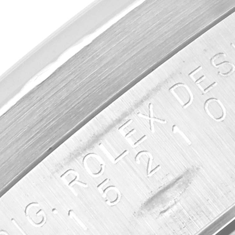 The image shows a close-up of the inner bezel or rehaut of a Rolex Date 15210 Men
s Stainless Steel Silver Dial 15210 Men
s Stainless Steel Silver Dial model watch, displaying the engraved serial and model information.