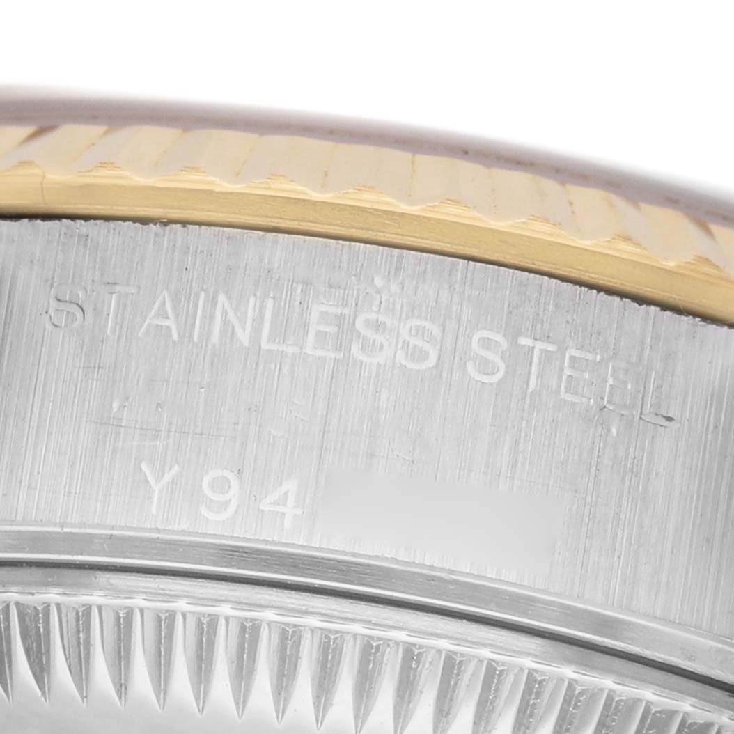 The image shows a close-up of the Rolex Datejust 79173 Women's Steel and Gold (two tone) Silver Dial case edge, highlighting the stainless steel and gold fluted bezel.