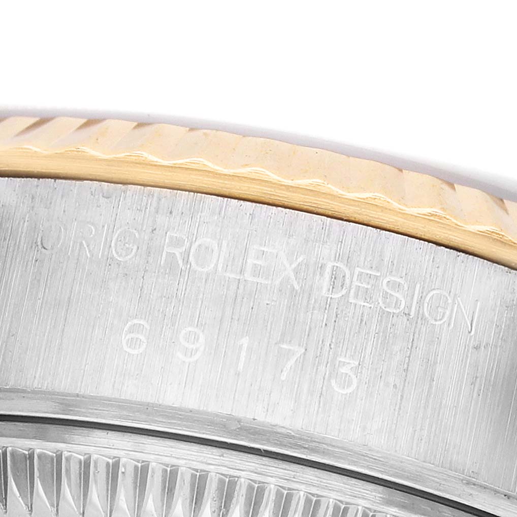 The image shows a close-up of the Rolex Datejust 69173 Women's Steel and Gold (two tone) Silver Dial case from the side, highlighting the crown and model number.