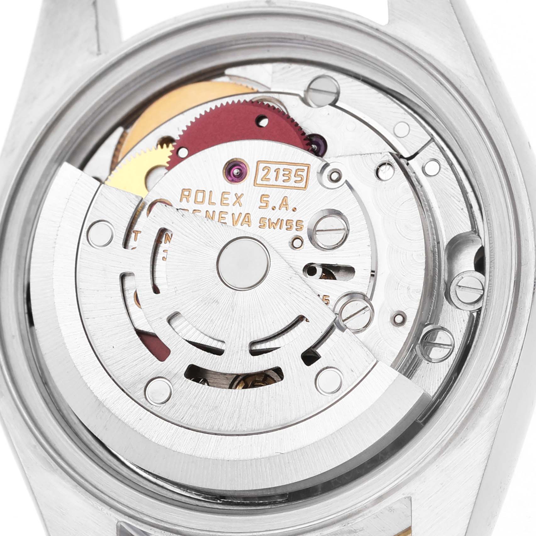 The image shows the movement mechanism of a Rolex Datejust 69173 Women's Steel and Gold (two tone) Silver Dial from a top-down angle, highlighting gears and engravings.