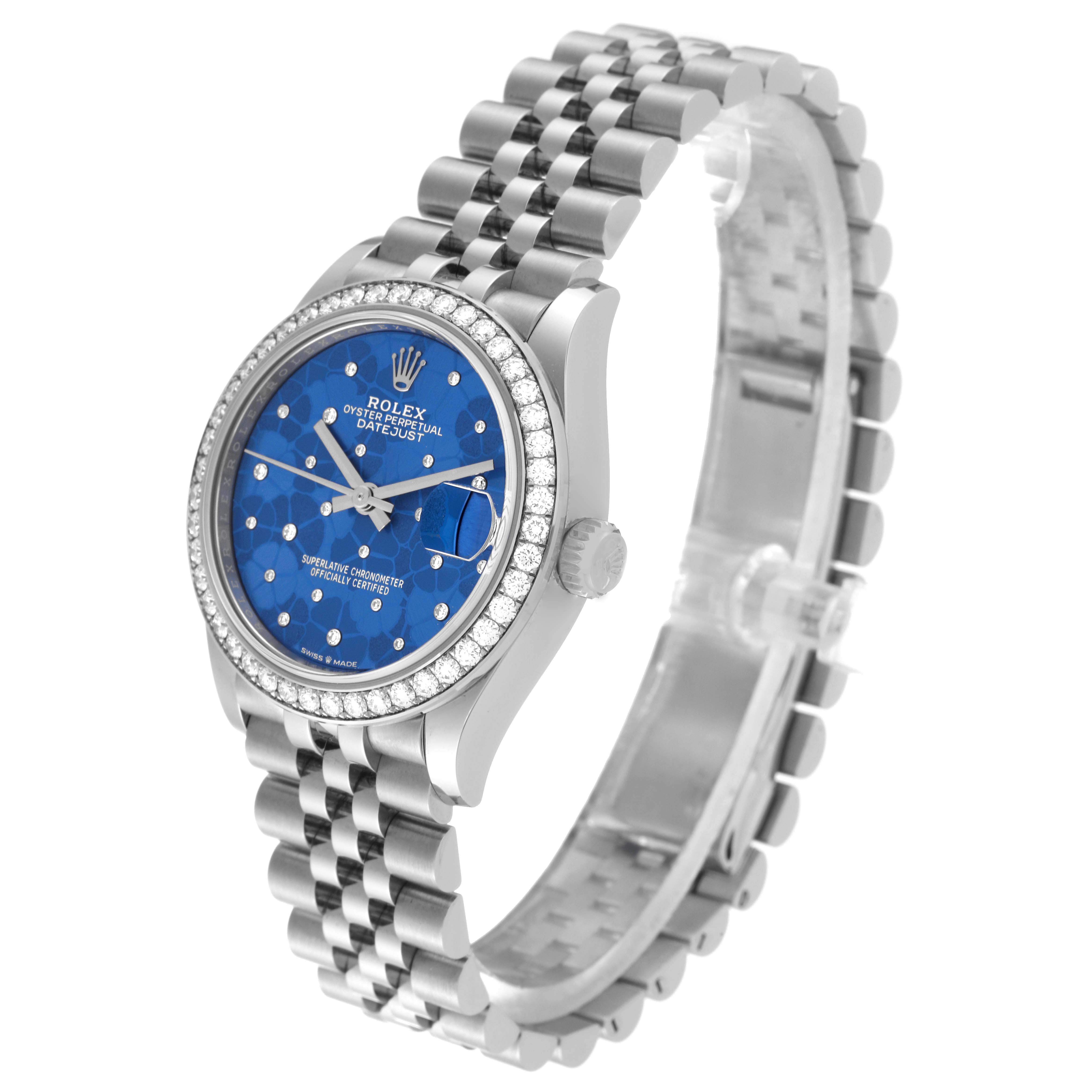 The Rolex Mid-Size 278384 Women
s Stainless Steel Blue Dial 278384 Women
s Stainless Steel Blue Dial Oyster Perpetual Datejust watch is shown from a 3/4 angle, displaying the dial, bezel, crown, and bracelet.