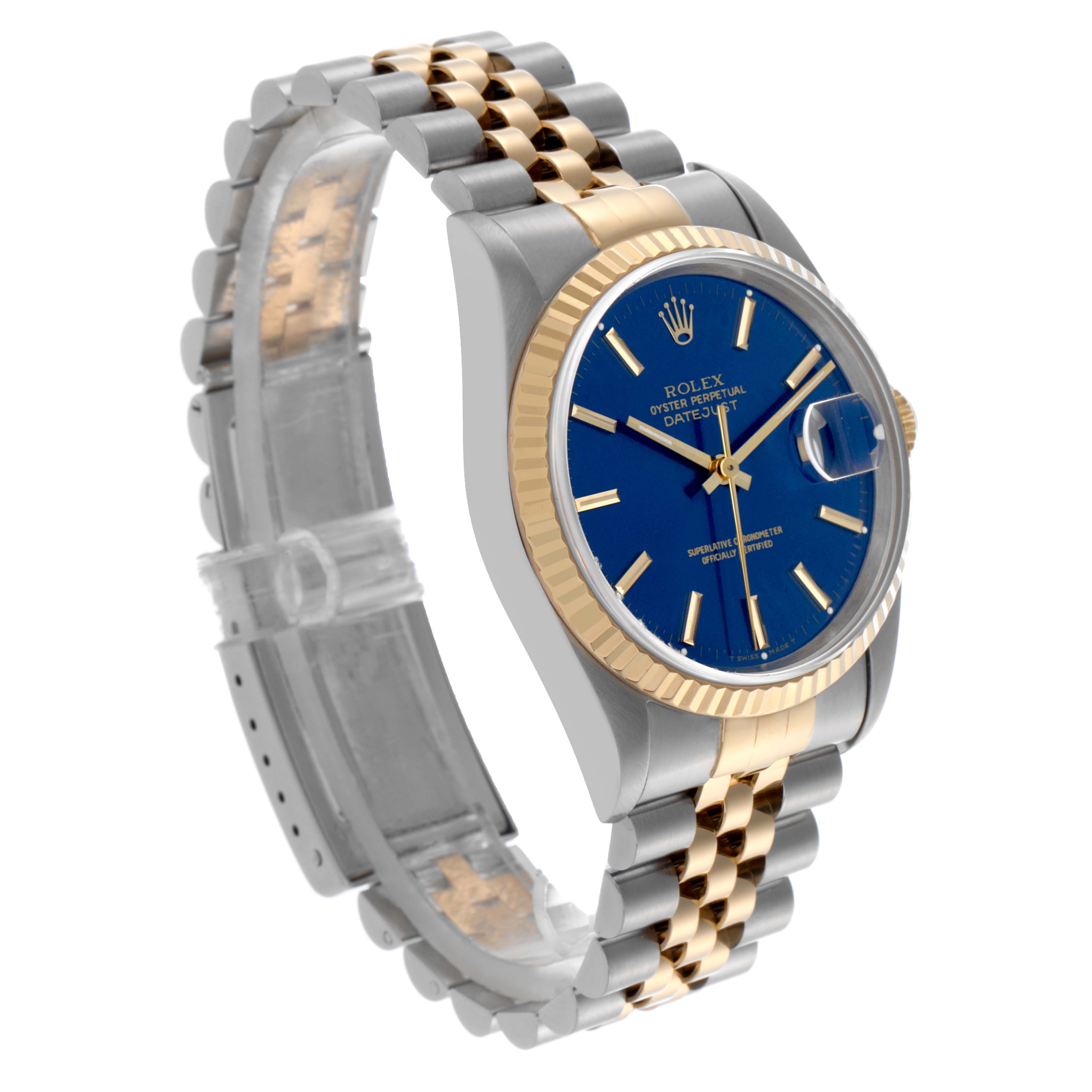 The Rolex Datejust 16233 Men's Steel and Gold (two tone) Blue Dial 16233 Men's Steel and Gold (two tone) Blue Dial is shown from an angled perspective, highlighting its blue dial, gold bezel, and two-tone bracelet.