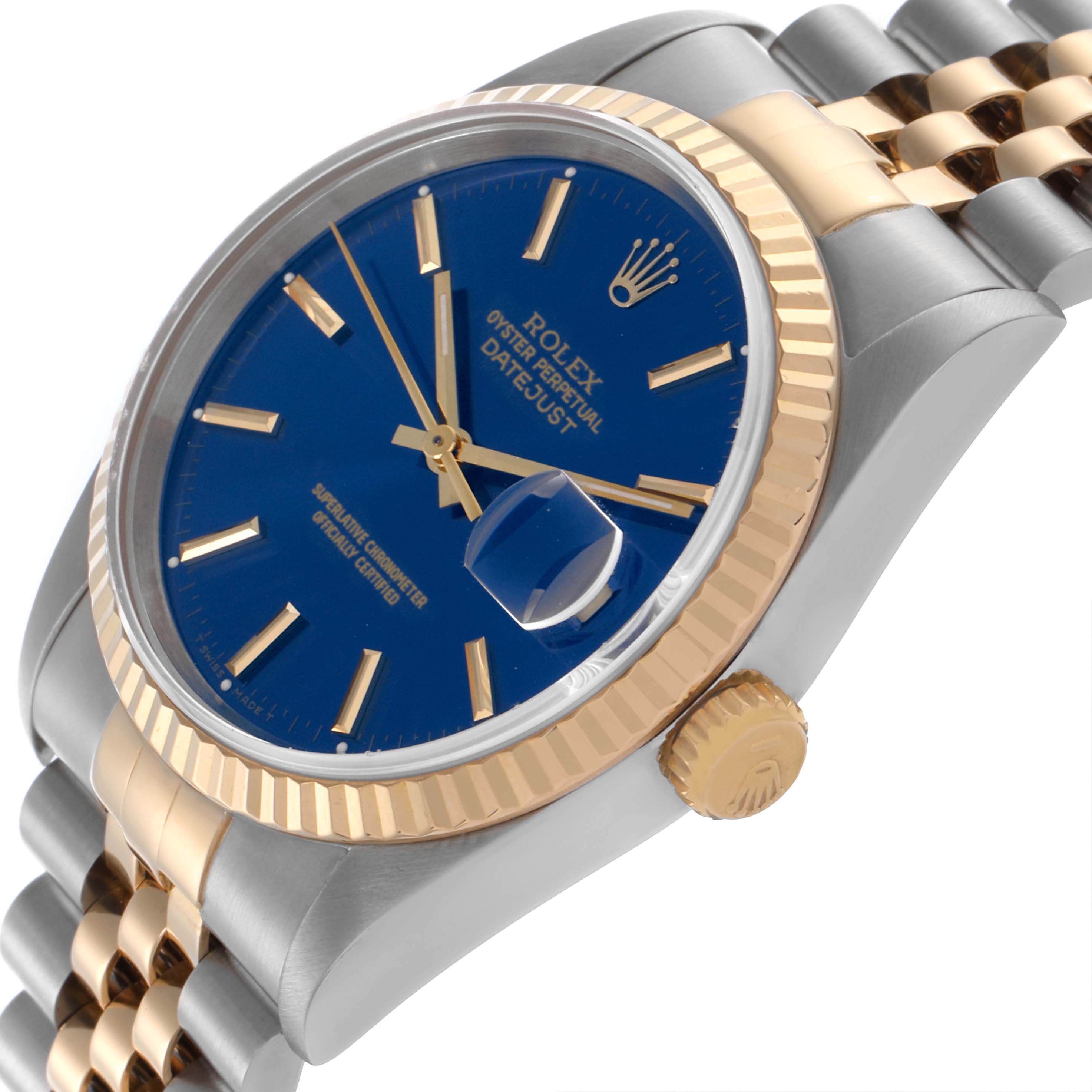 The Rolex Datejust 16233 Men's Steel and Gold (two tone) Blue Dial 16233 Men's Steel and Gold (two tone) Blue Dial watch is shown at a side angle, highlighting the blue dial, gold fluted bezel, and two-tone bracelet.