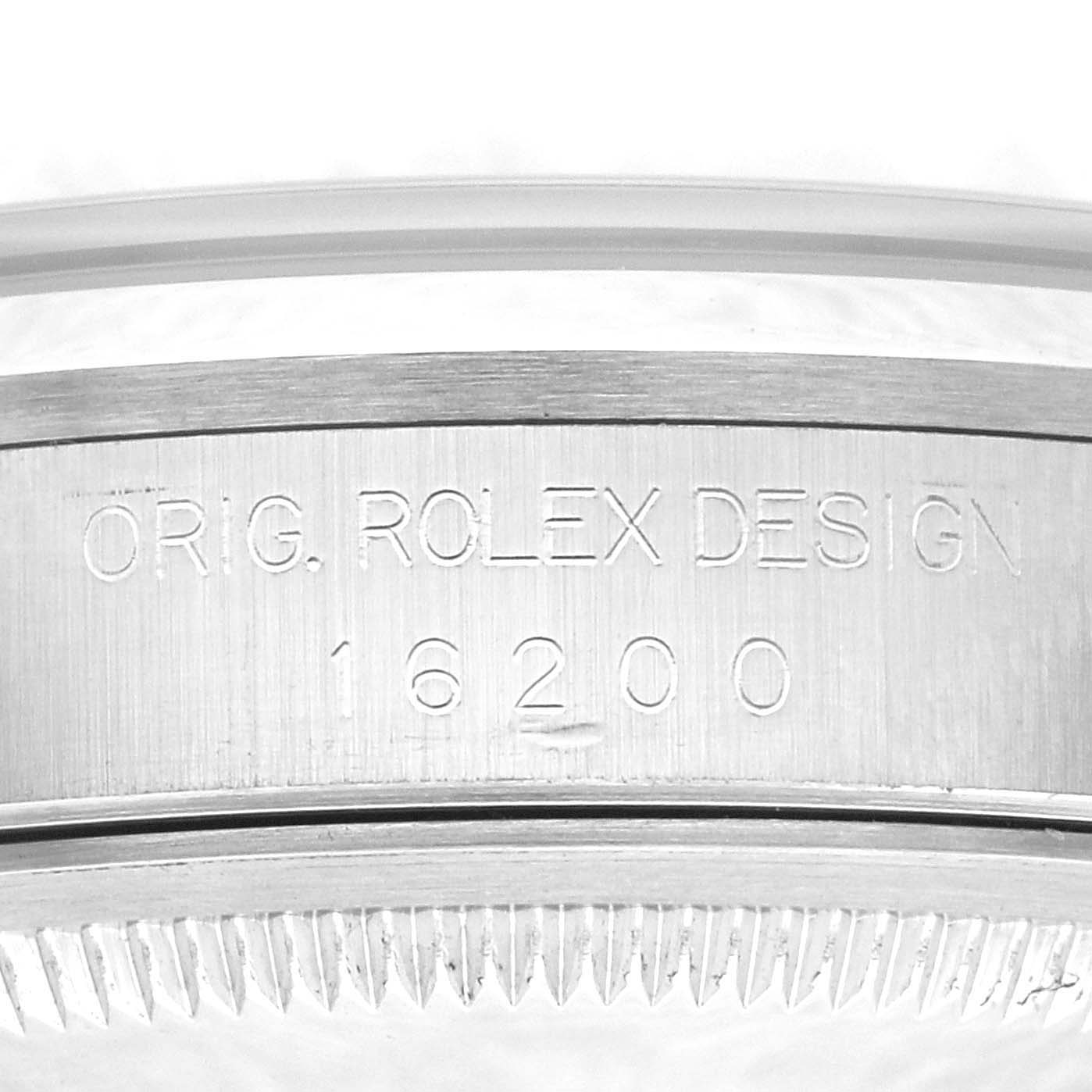 This image shows a close-up of the engraved side of the case for a Datejust model by Rolex.