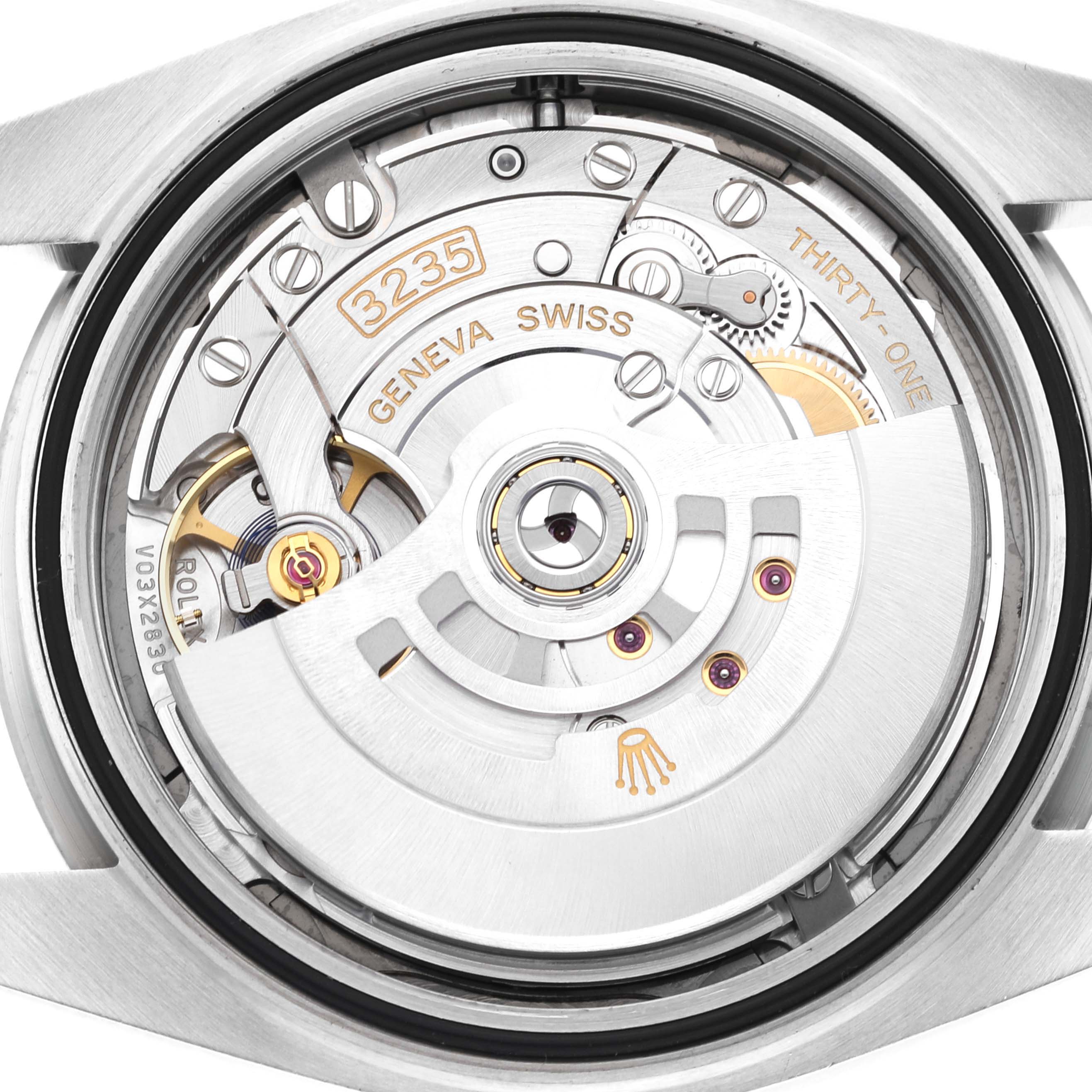 The image shows a close-up view of the internal mechanical movement of the Rolex Datejust 41 126334 Men
s Stainless Steel Grey Dial 126334 Men
s Stainless Steel Grey Dial watch.